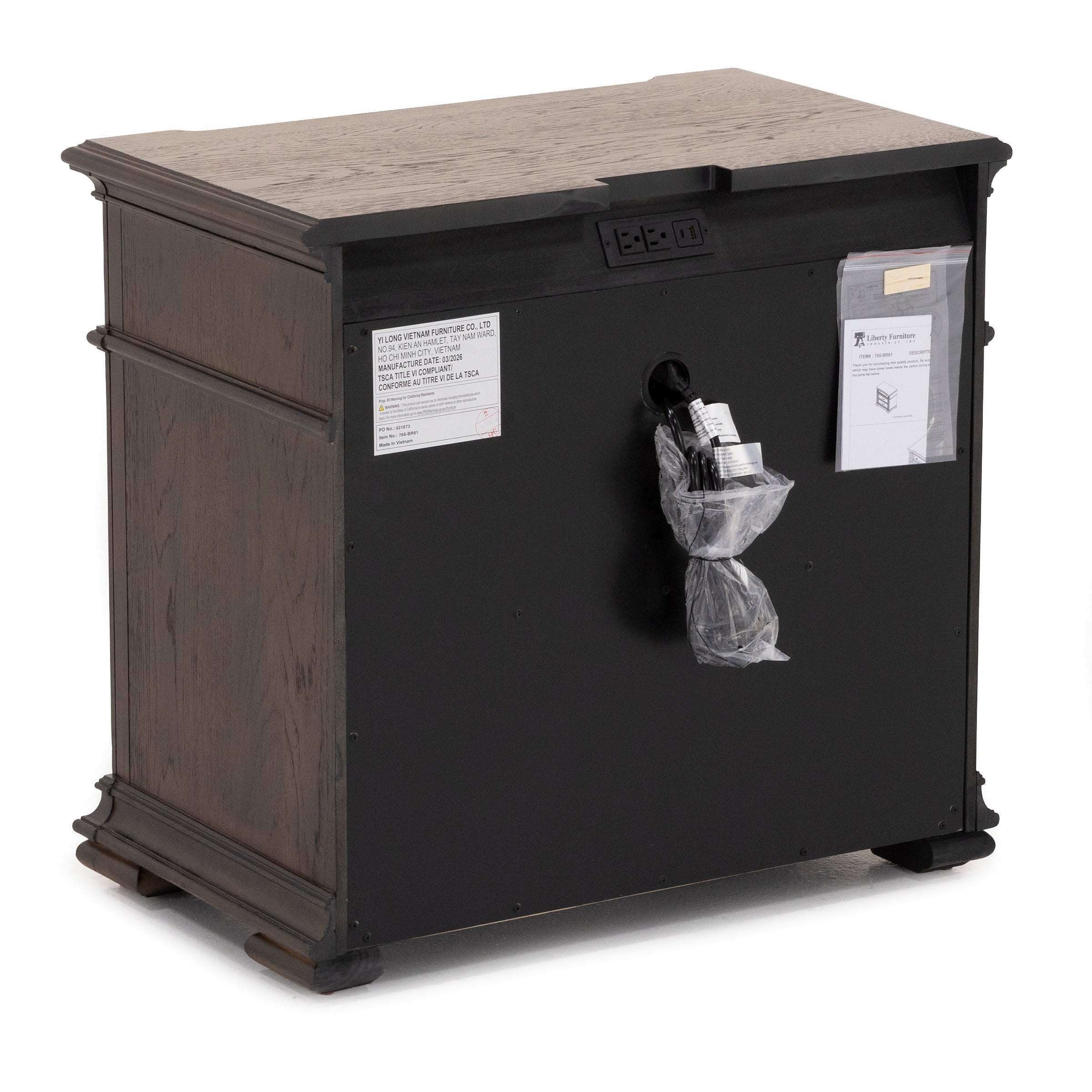 Back view of a wooden cabinet showing electrical outlets and a bagged power cord.
