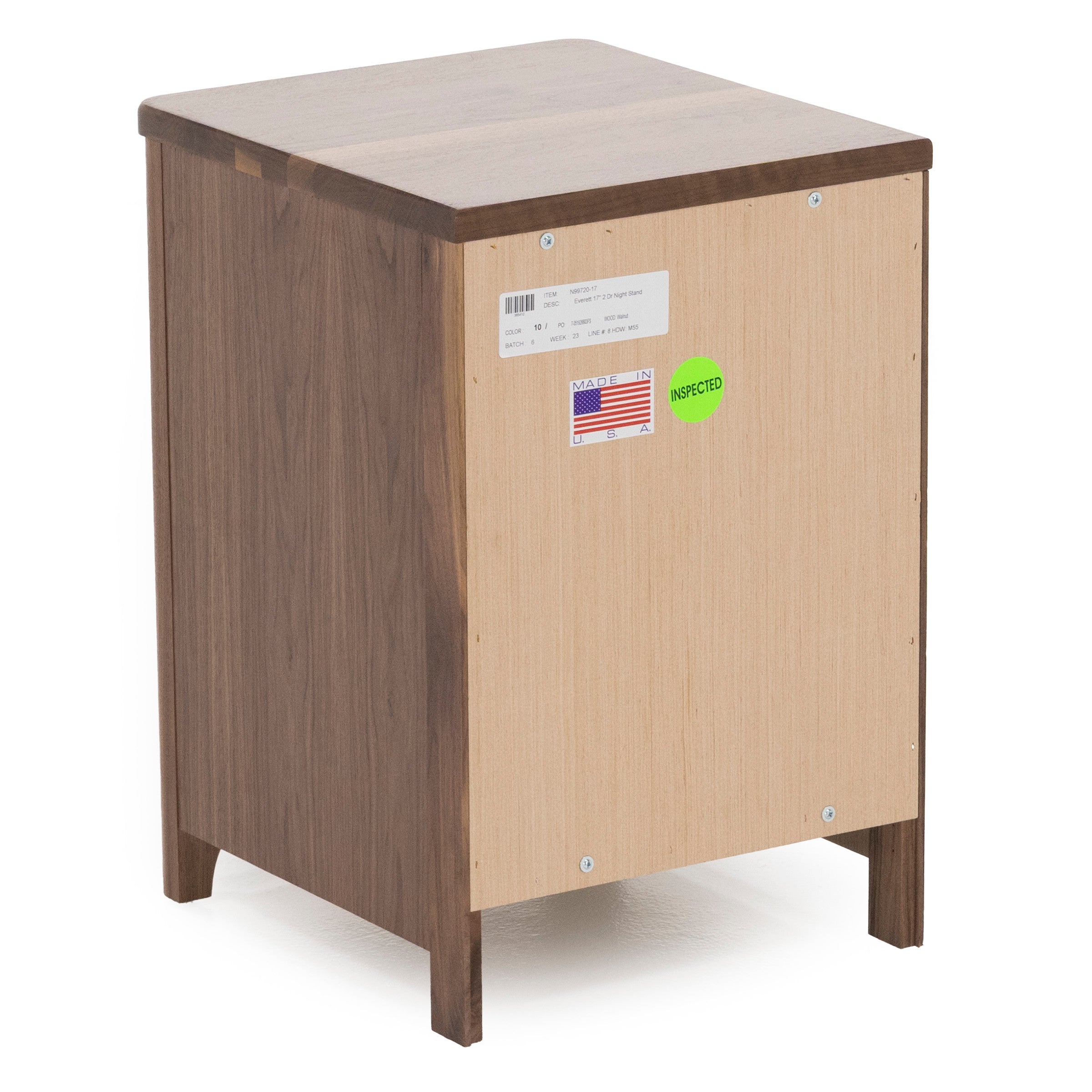 Back view of a wooden nightstand, showing inspection and manufacturing labels.