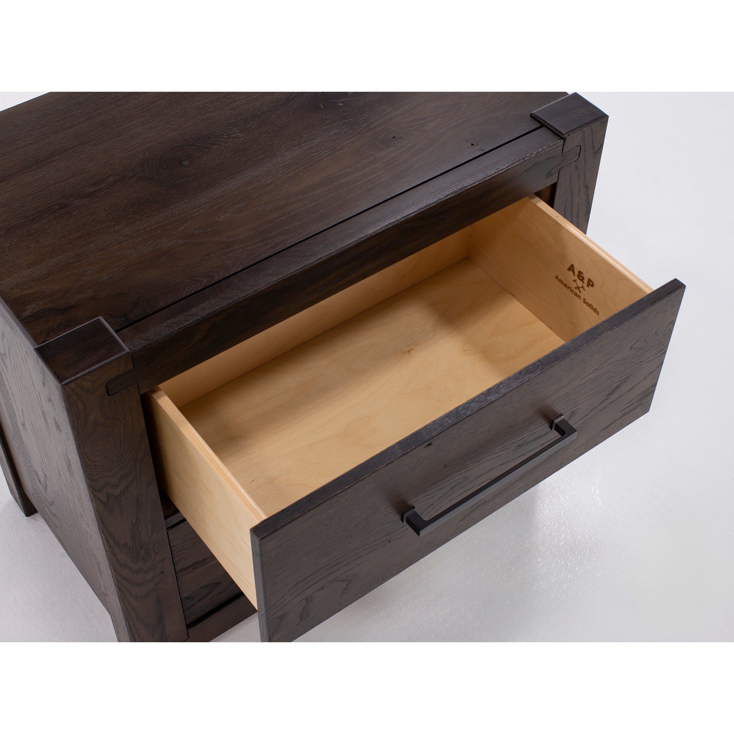 Open dark wood drawer with visible interior and black handle.
