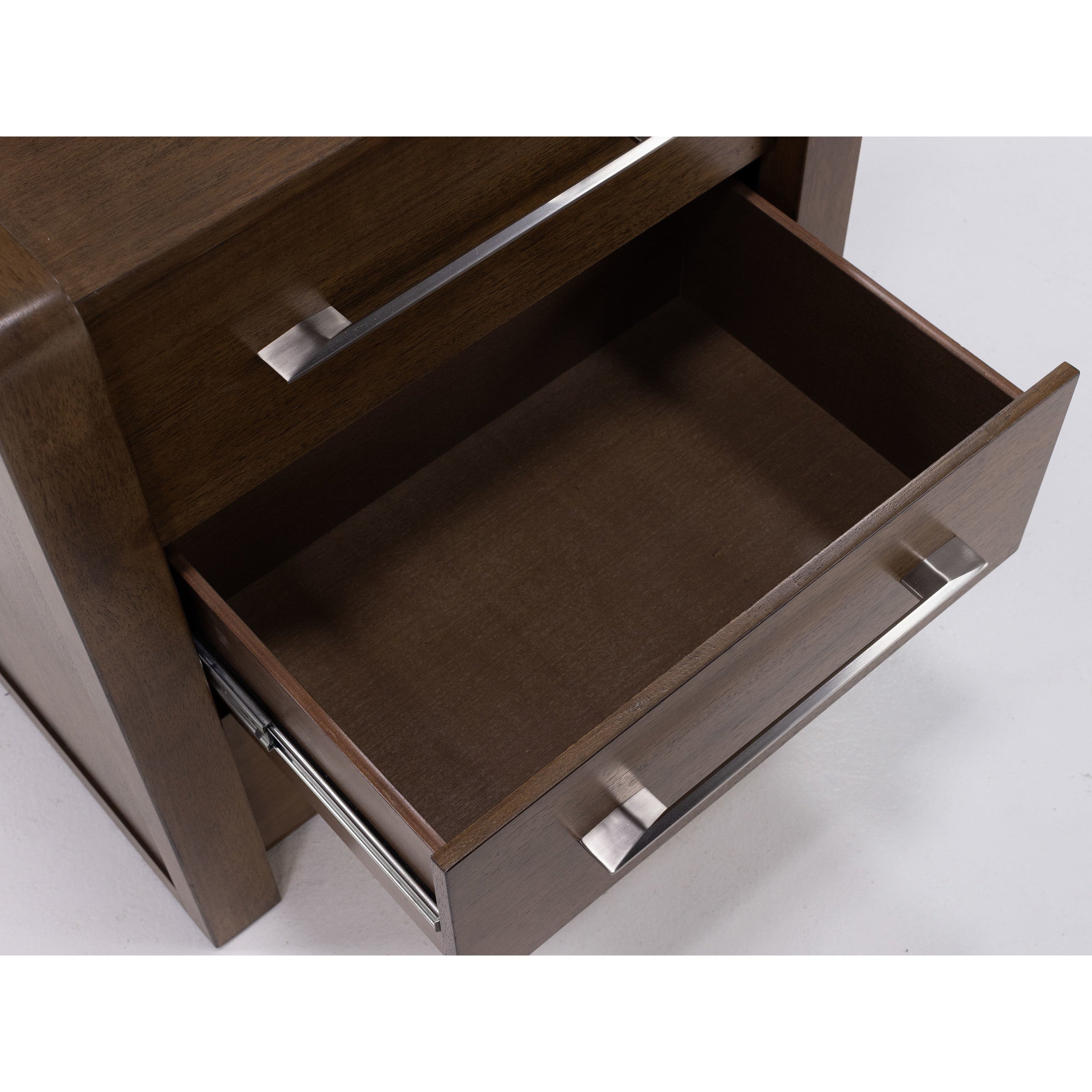 Open wooden drawer with metal handle.