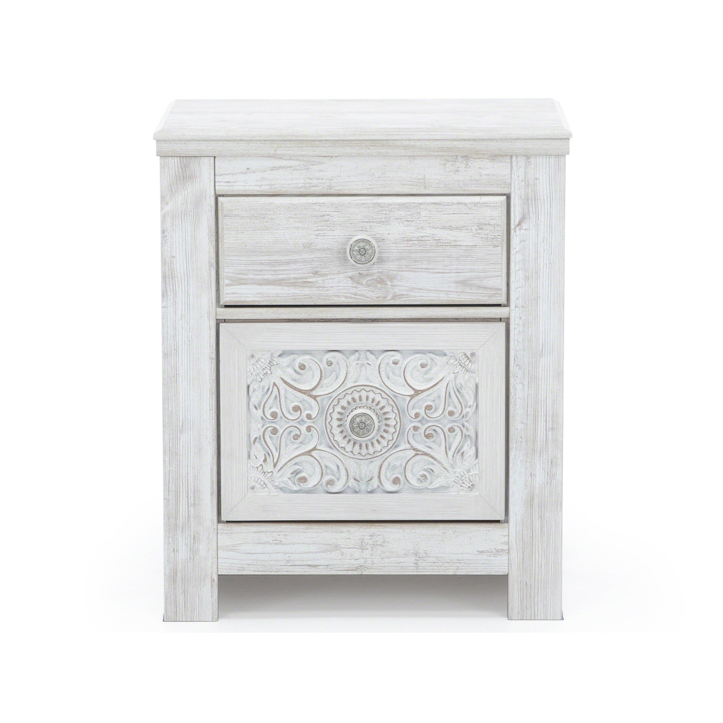White nightstand with one drawer and ornate carved door panel.