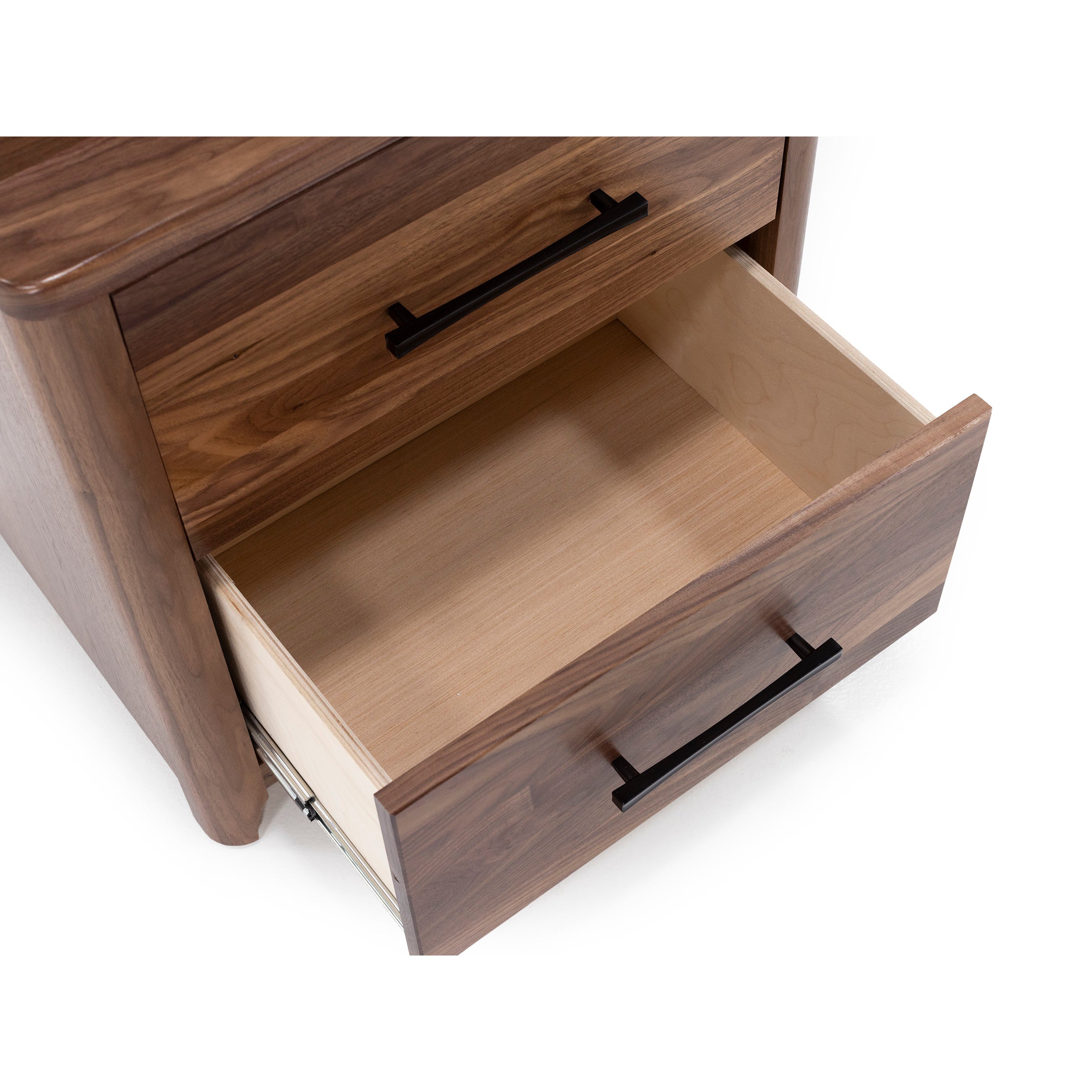 Open wooden drawer with black handle, shown from above.