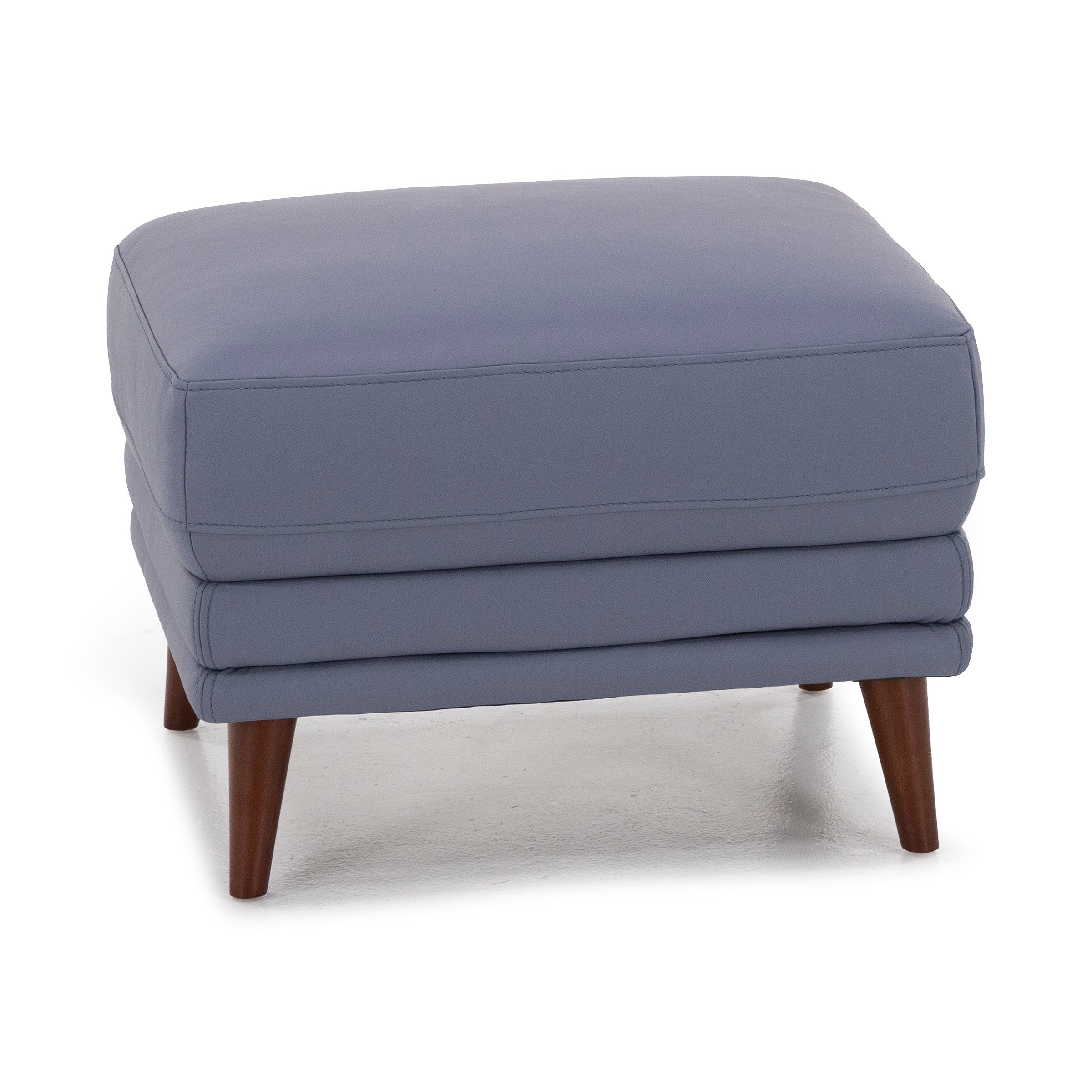 Modern blue ottoman with wooden legs.