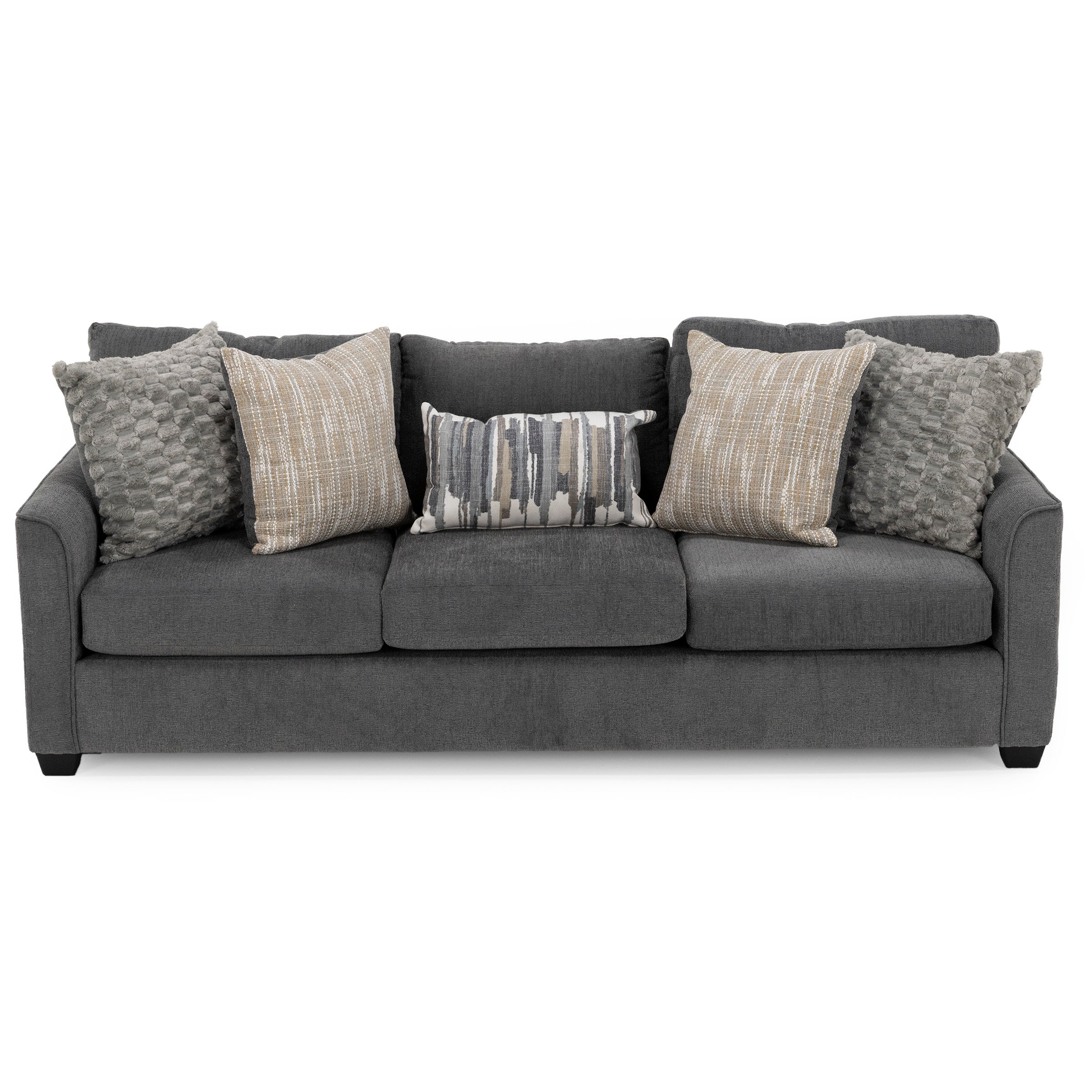 Dark gray sofa with five accent pillows in various patterns and textures.