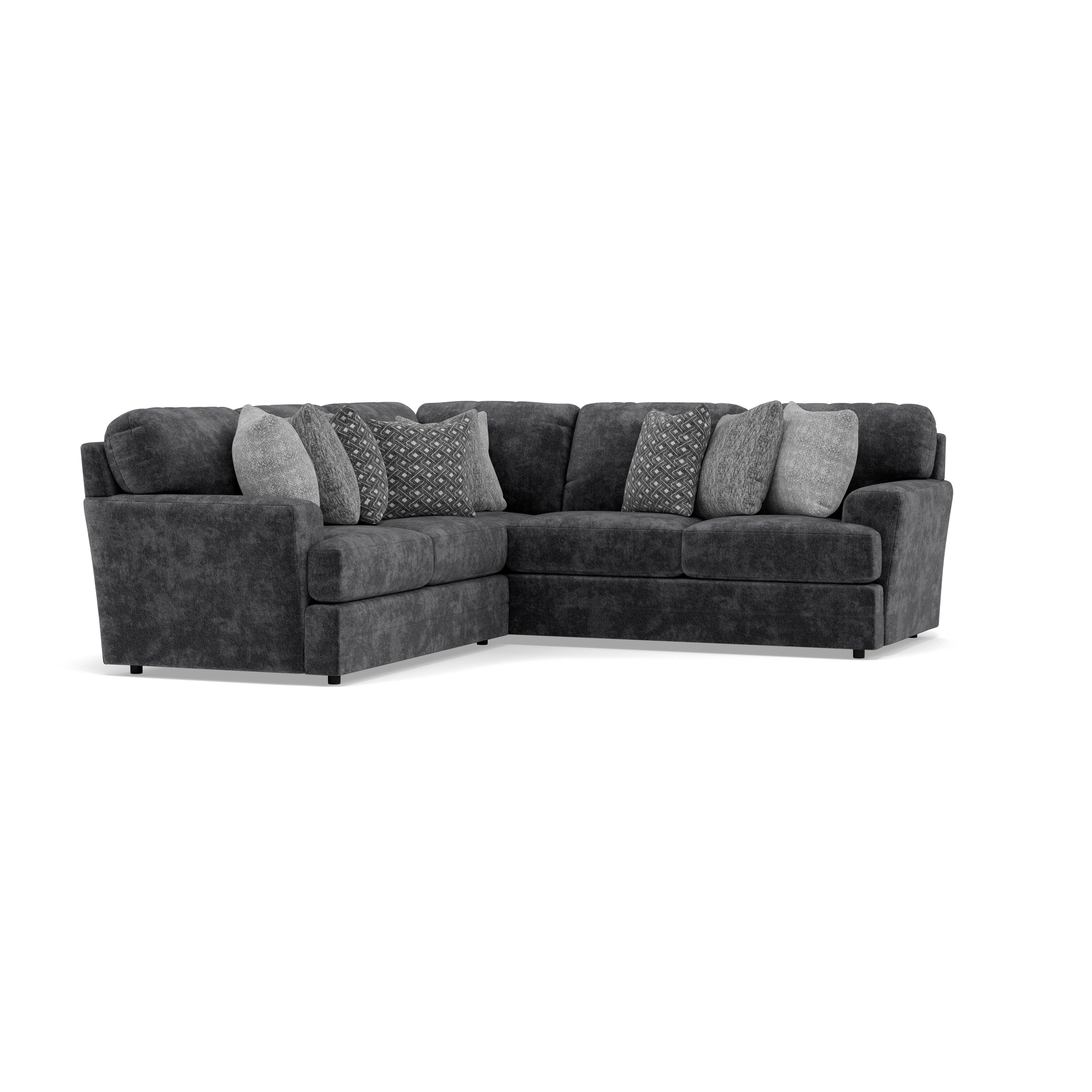 Dark gray sectional sofa with patterned throw pillows