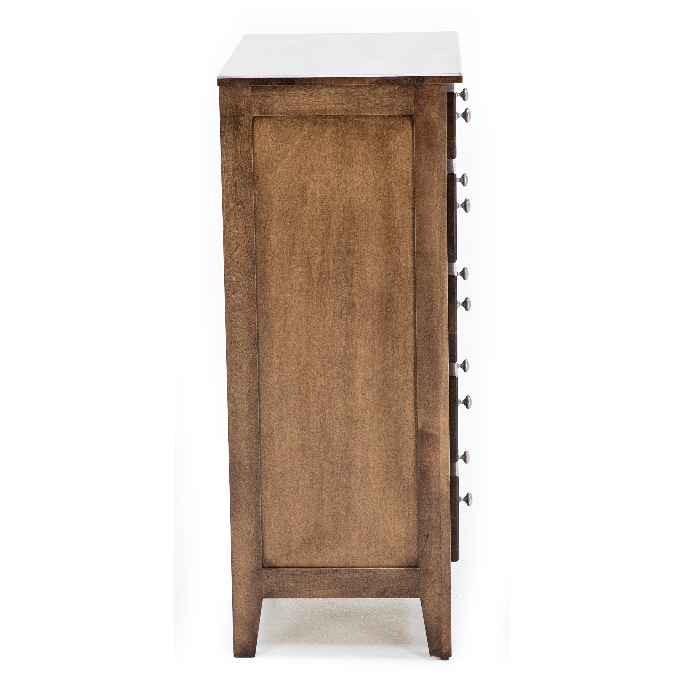 Side view of a wooden dresser showing drawer handles.