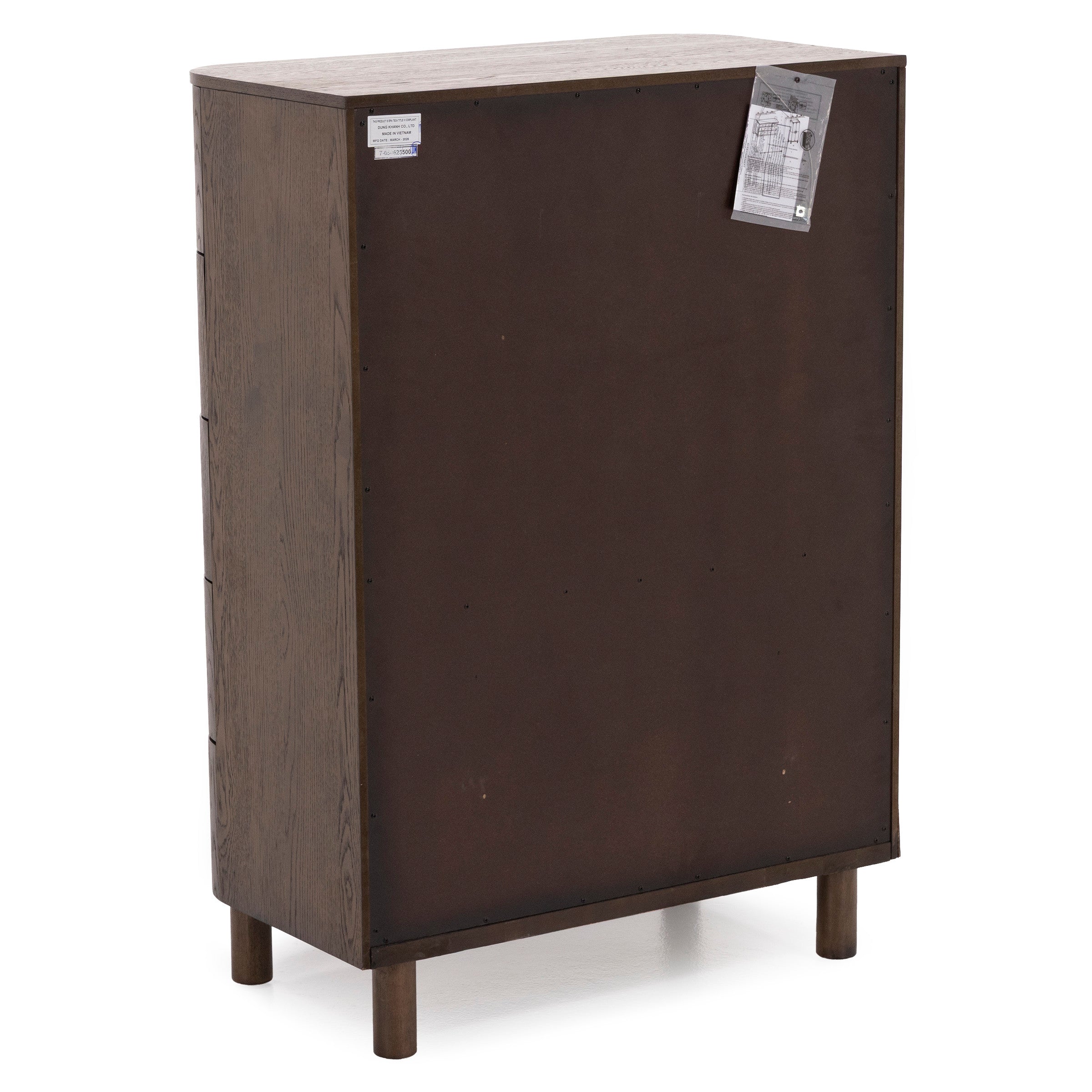 Back view of a brown wooden dresser with attached labels and instructions.