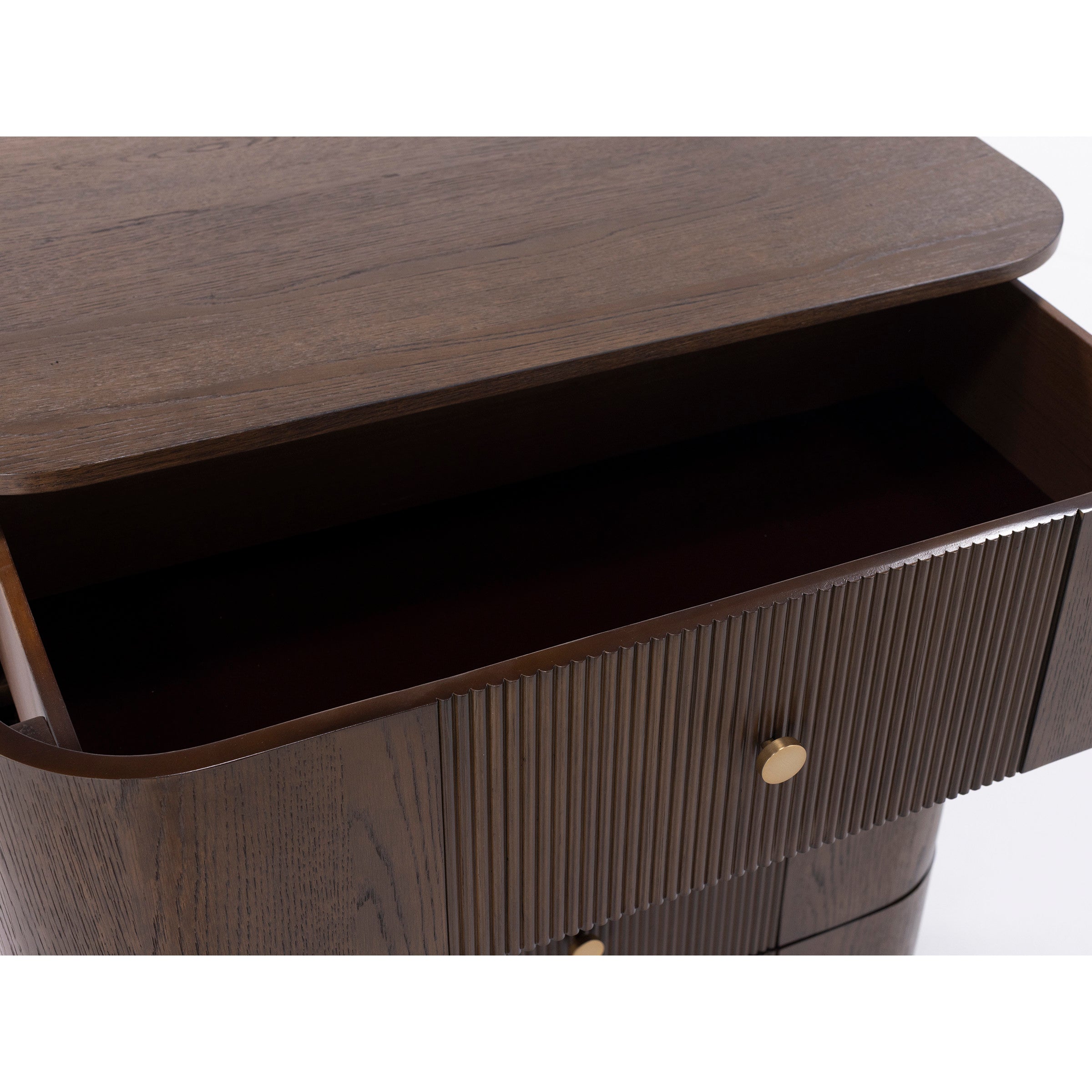 Open wooden drawer with gold knobs on a dark wood cabinet.