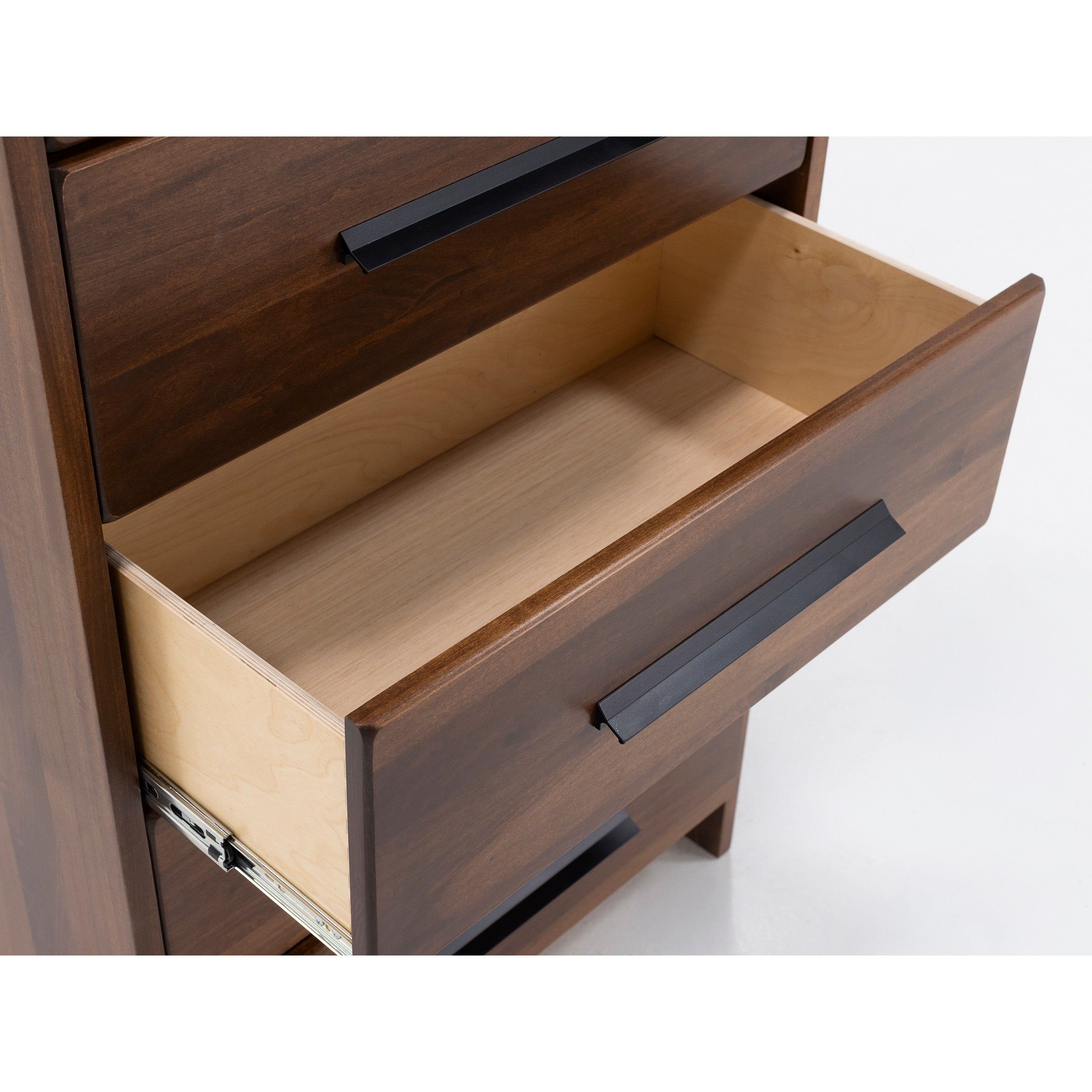 Open wooden drawer with metal handle on dresser, shown empty.