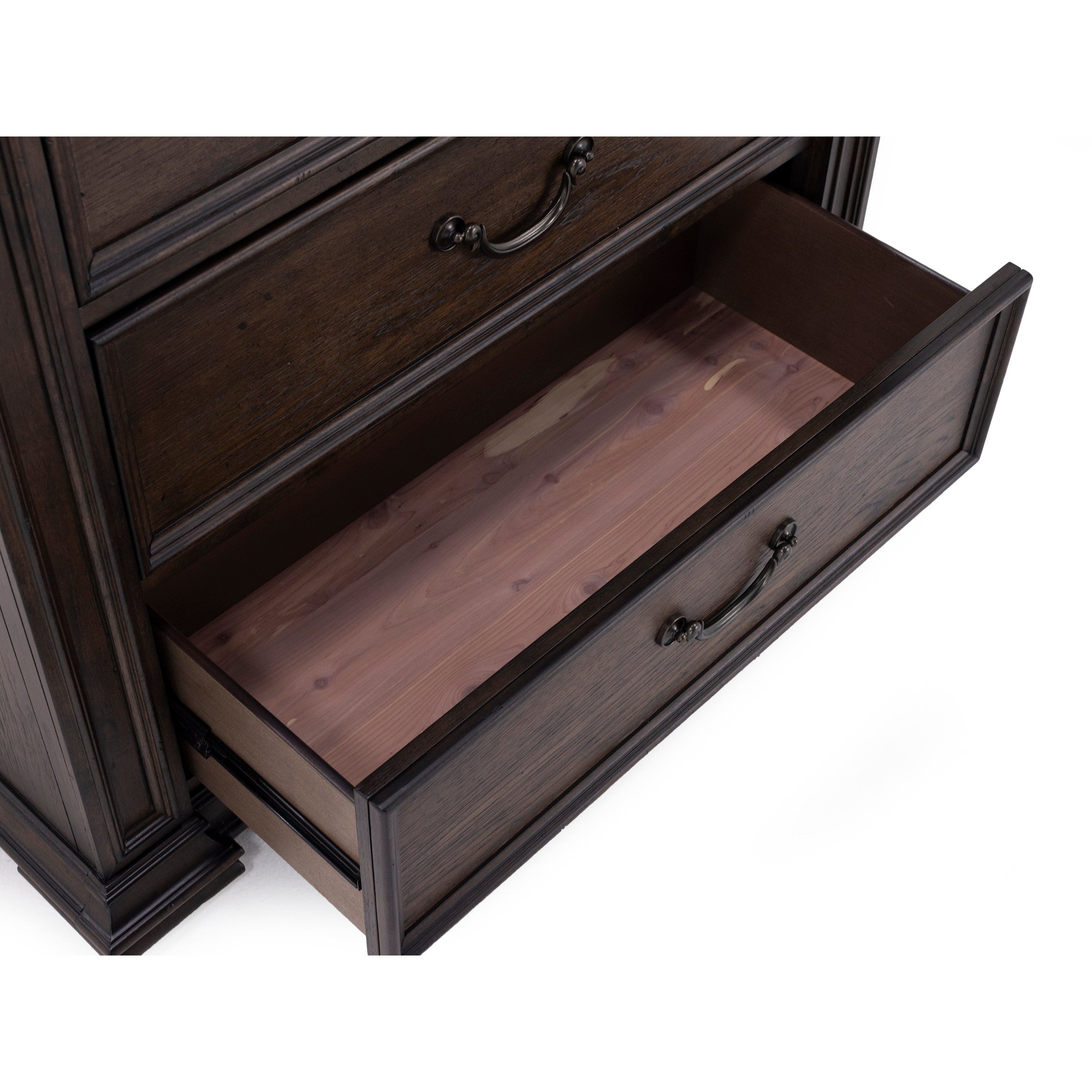 Open drawer of a dark wood dresser showing interior.