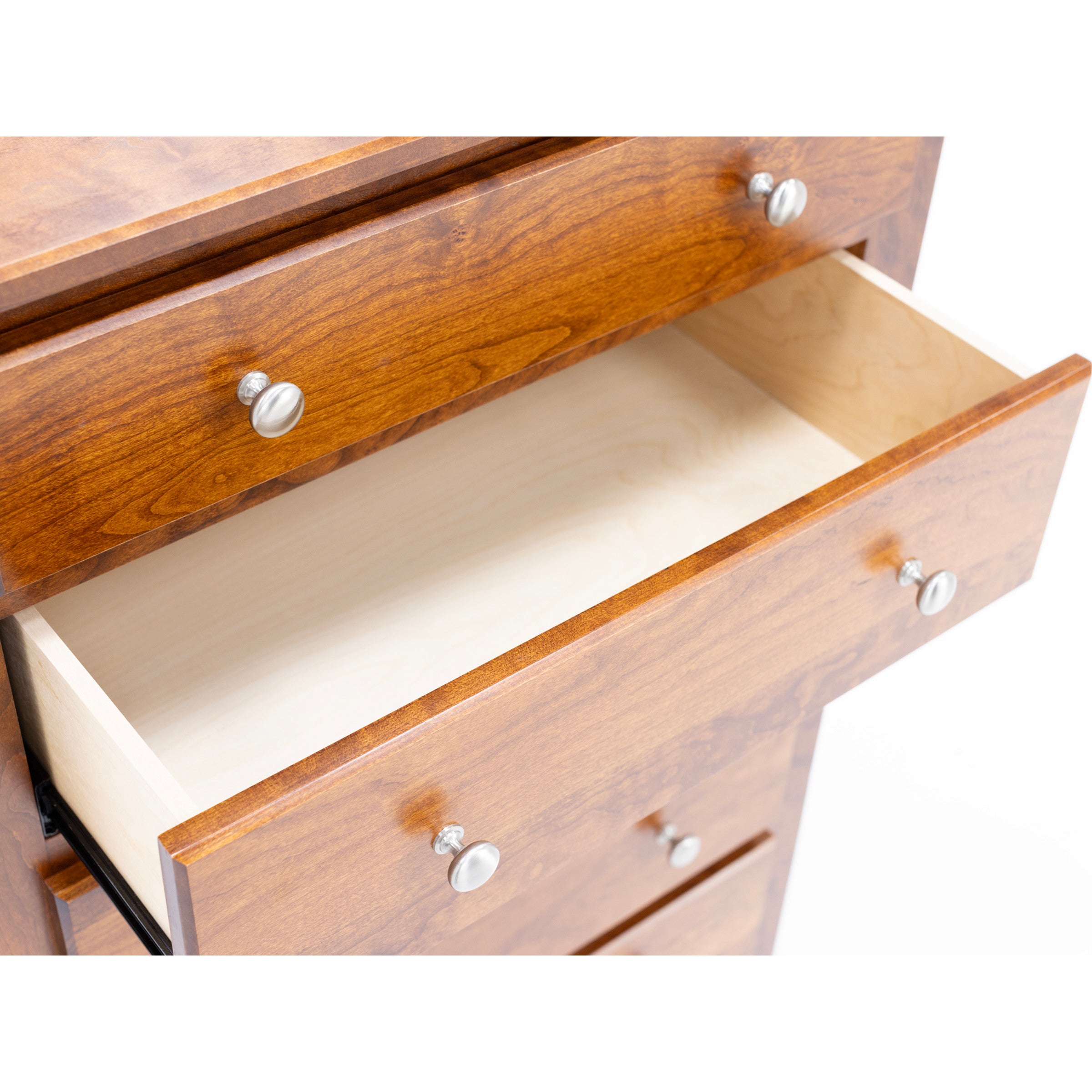 Open wooden drawer with metal knobs, empty interior visible.
