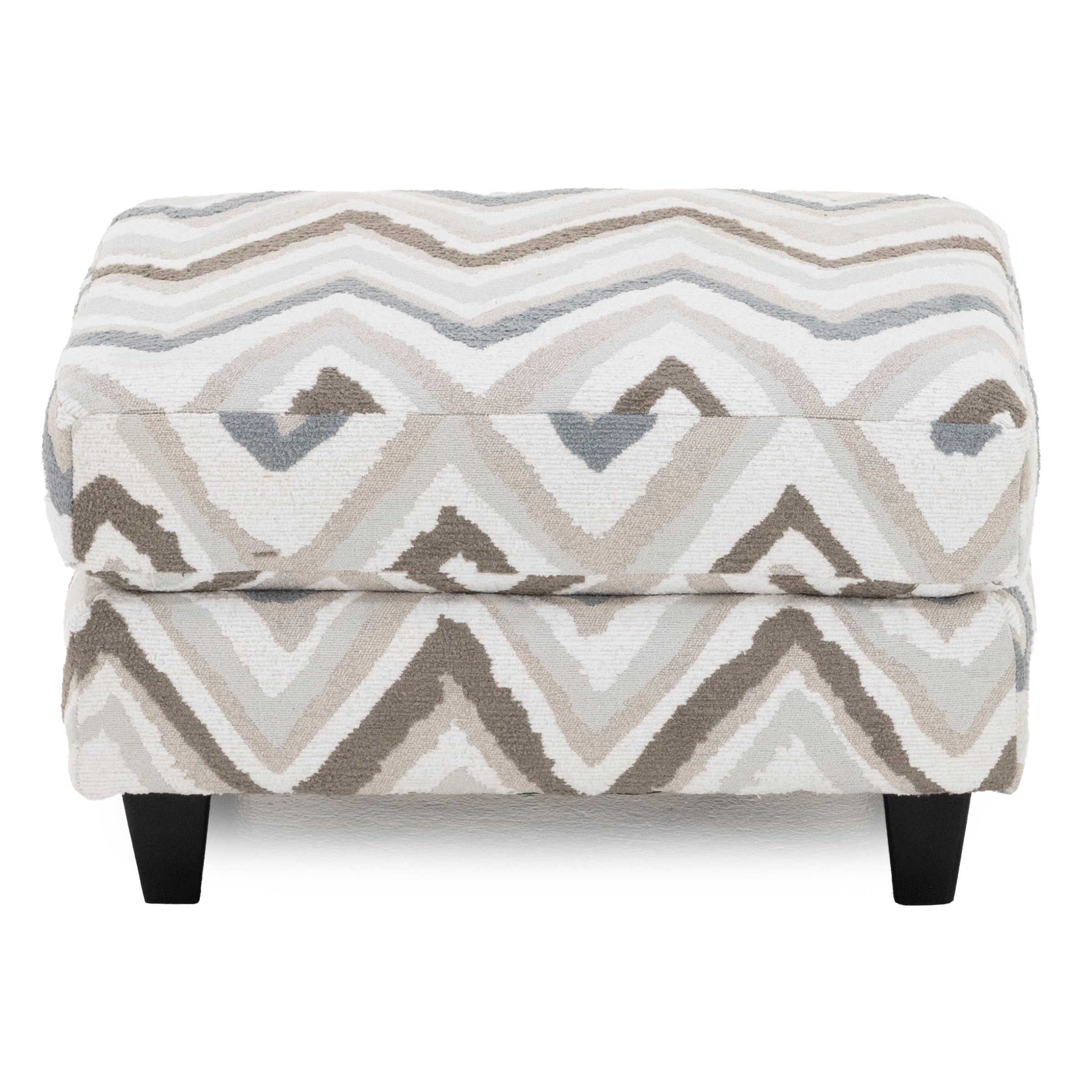 Patterned ottoman with neutral zigzag design and dark legs.