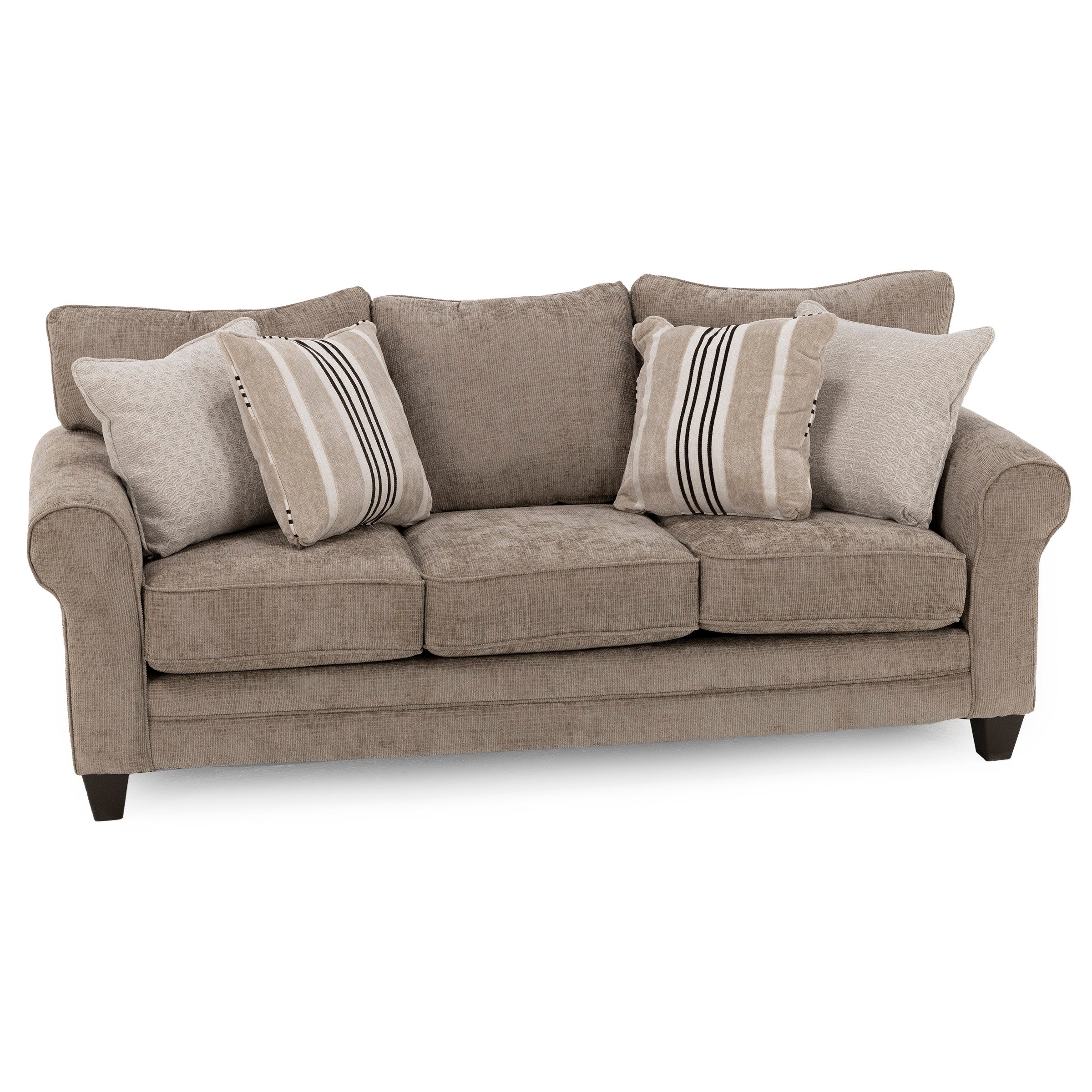 Beige upholstered sofa with three seat cushions and four decorative pillows.