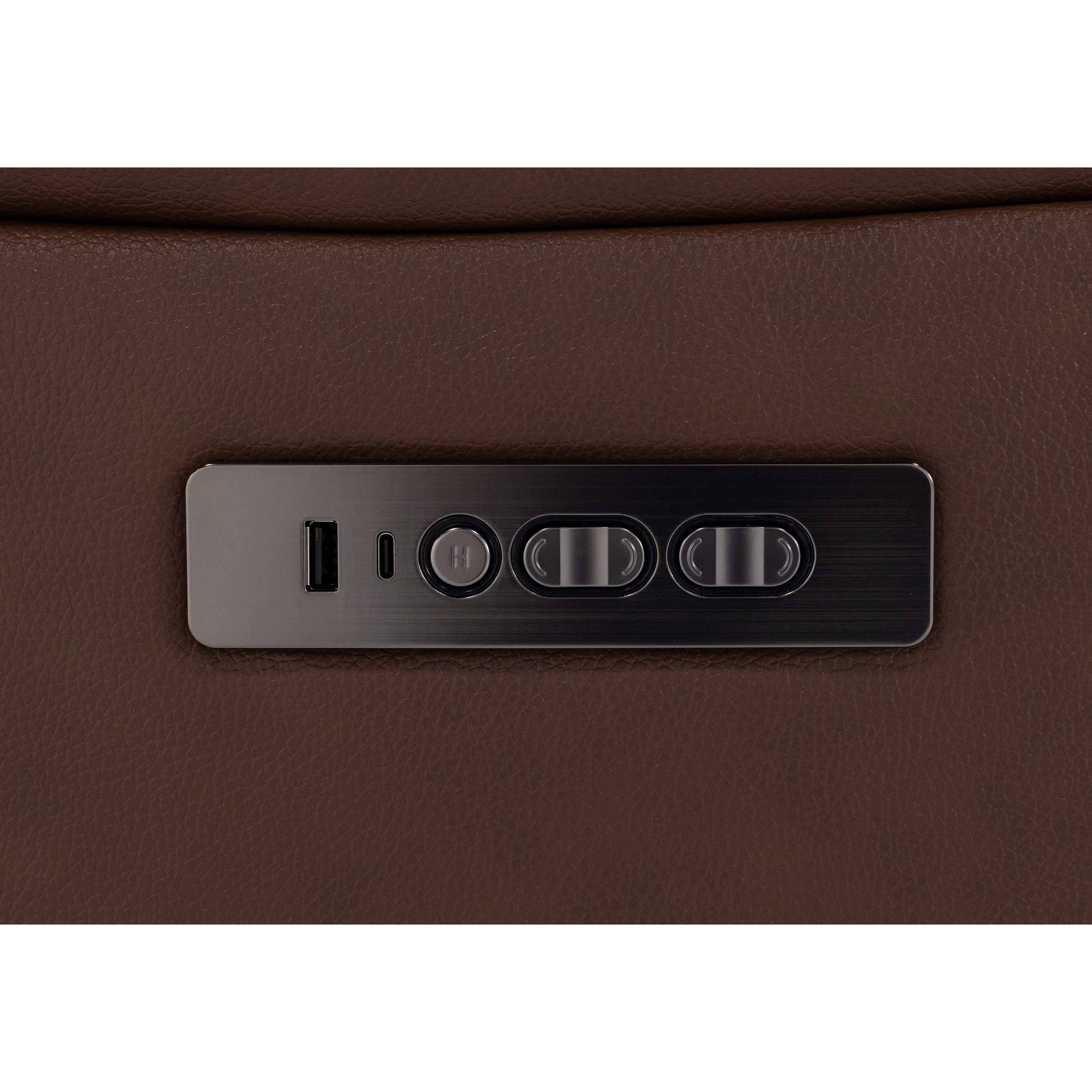 Control panel on brown leather furniture with USB ports and adjustment buttons.