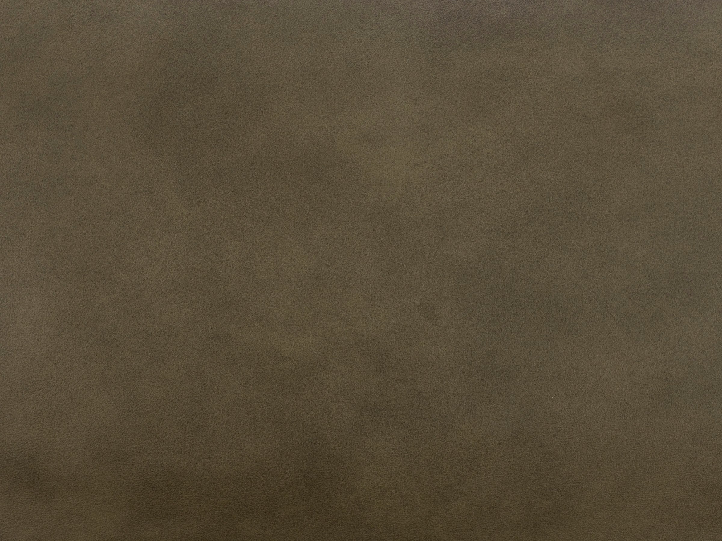 Brown textured leather material sample.