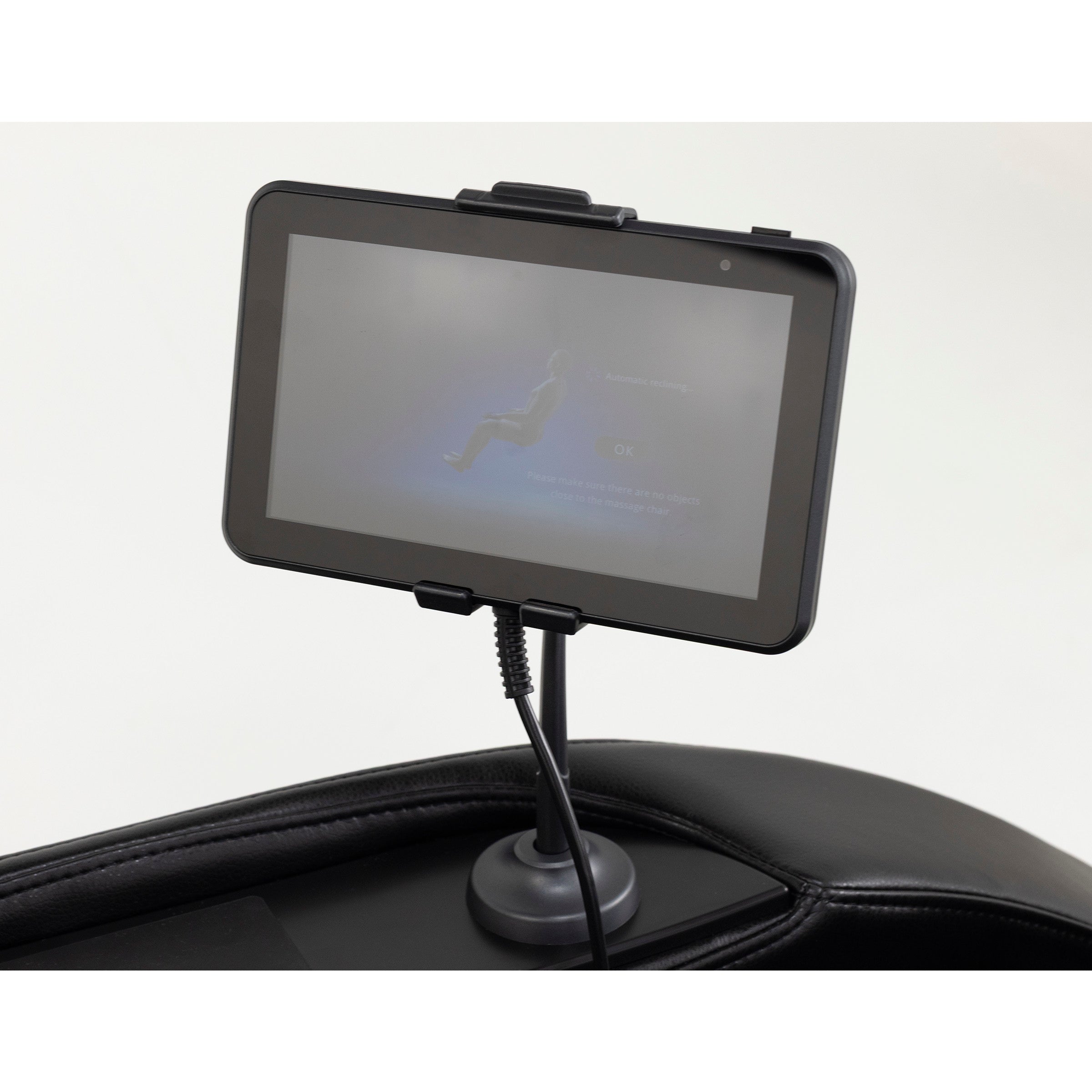 Tablet control panel mounted on a stand, attached to a massage chair.