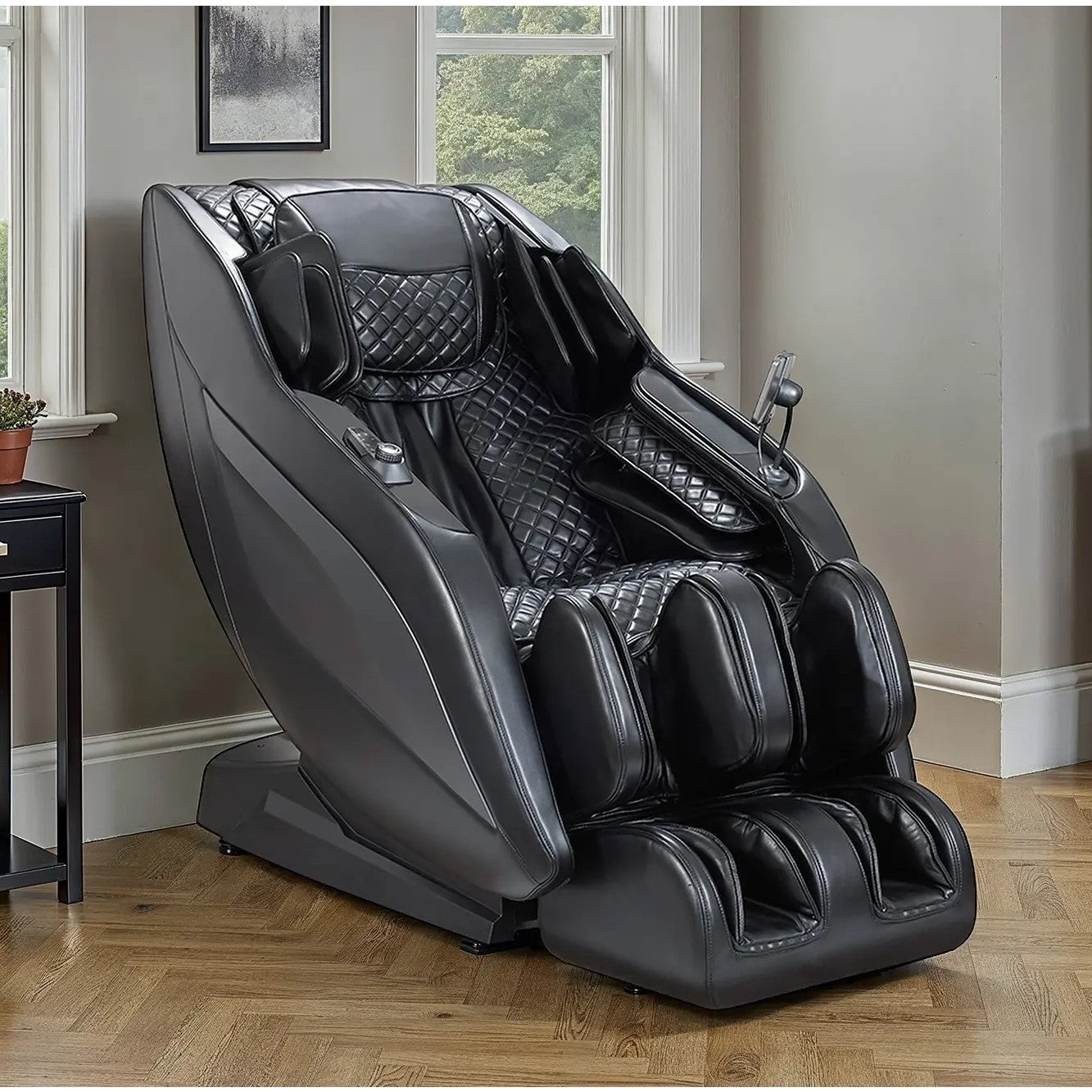 Black massage chair with padded seating in a modern living room.