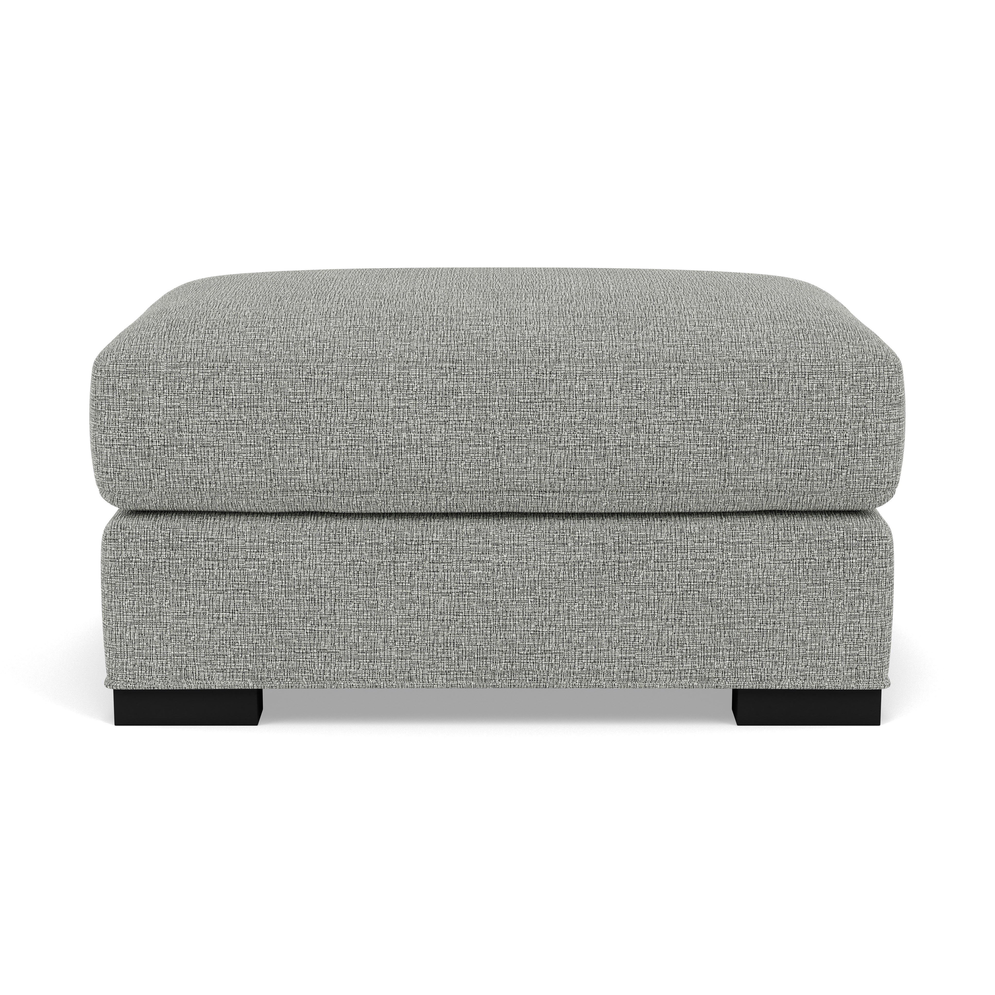 Gray rectangular ottoman with textured fabric and short black legs.