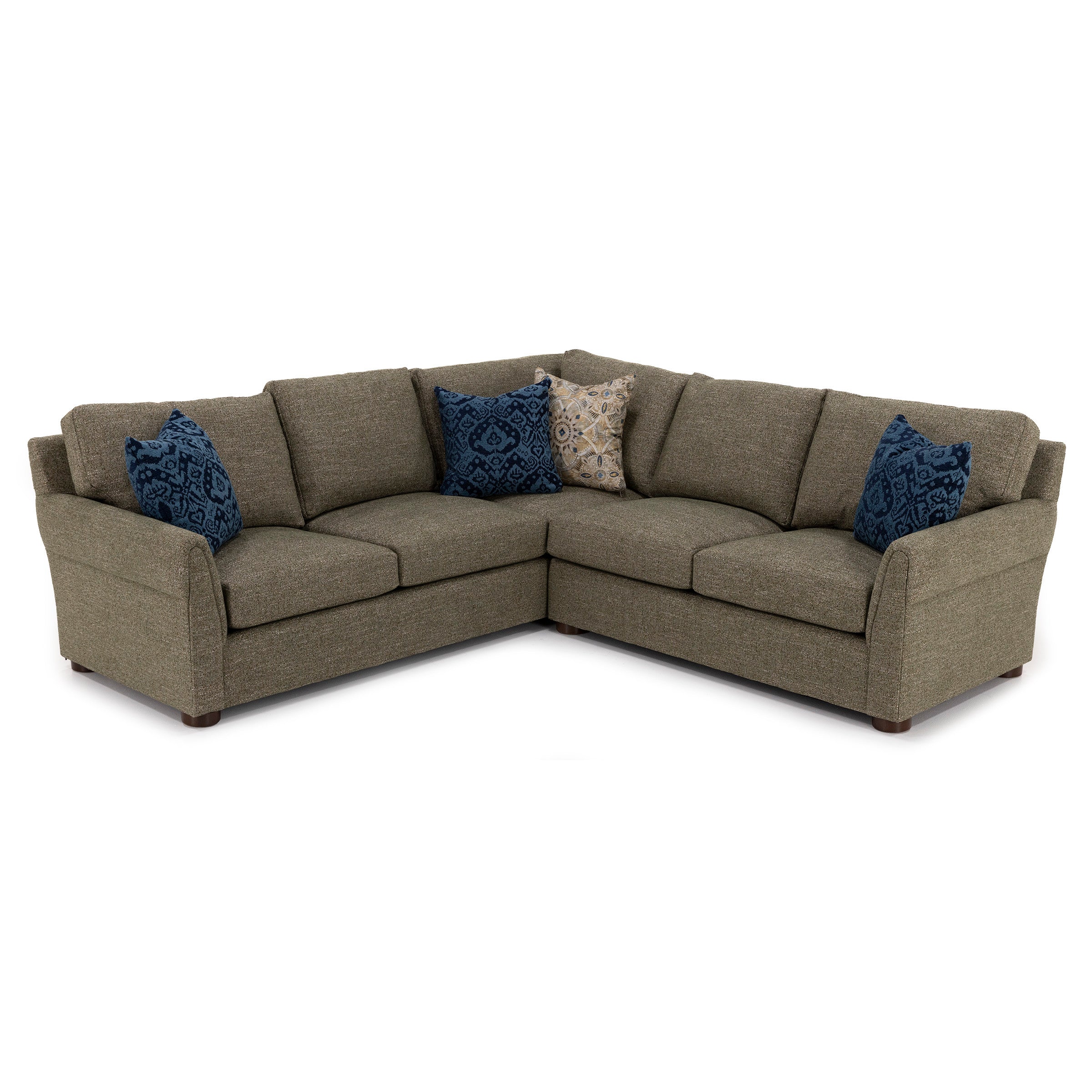 L-shaped sectional sofa with three blue patterned pillows and one tan pillow.
