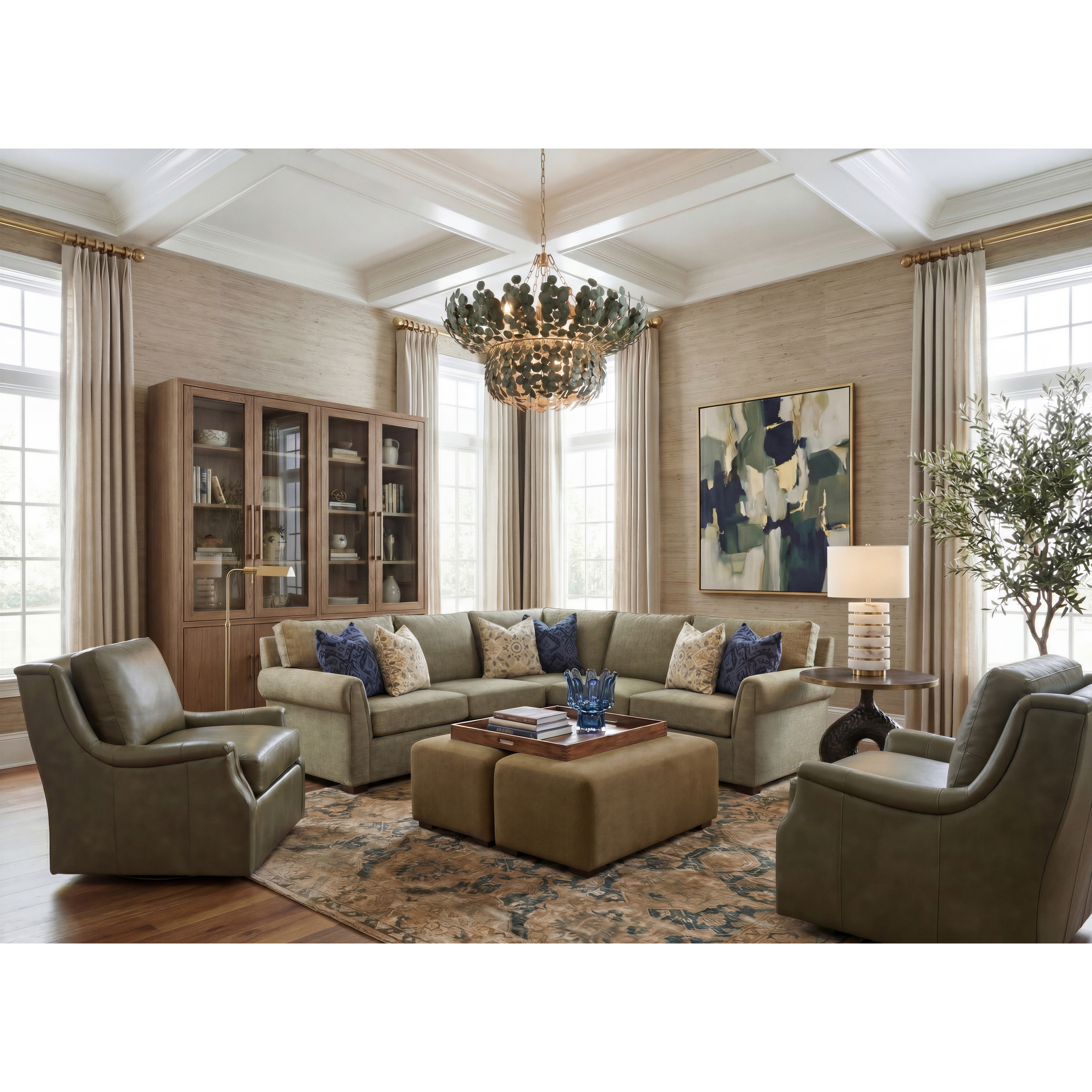 Spacious living room with neutral sectional, green chairs, large chandelier, and abstract wall art.
