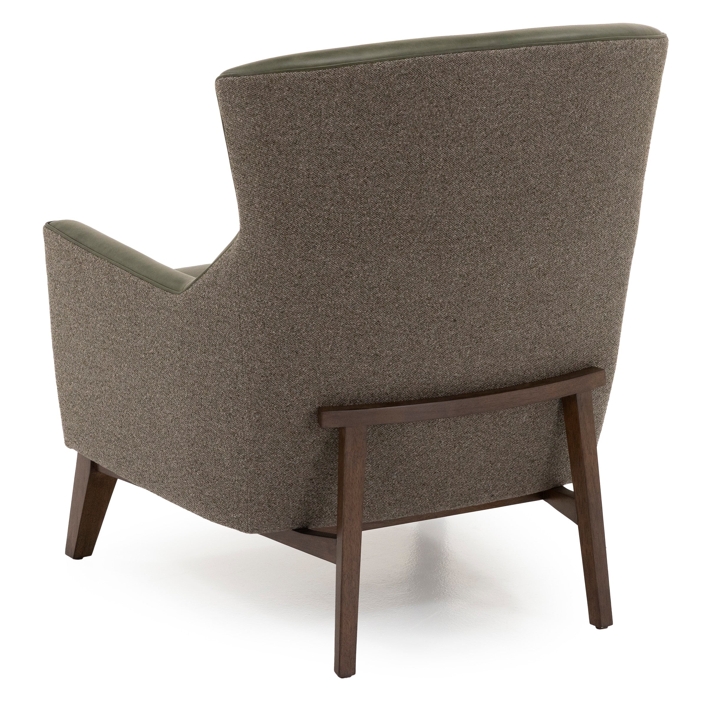 Back view of a modern armchair with brown fabric and wooden legs.