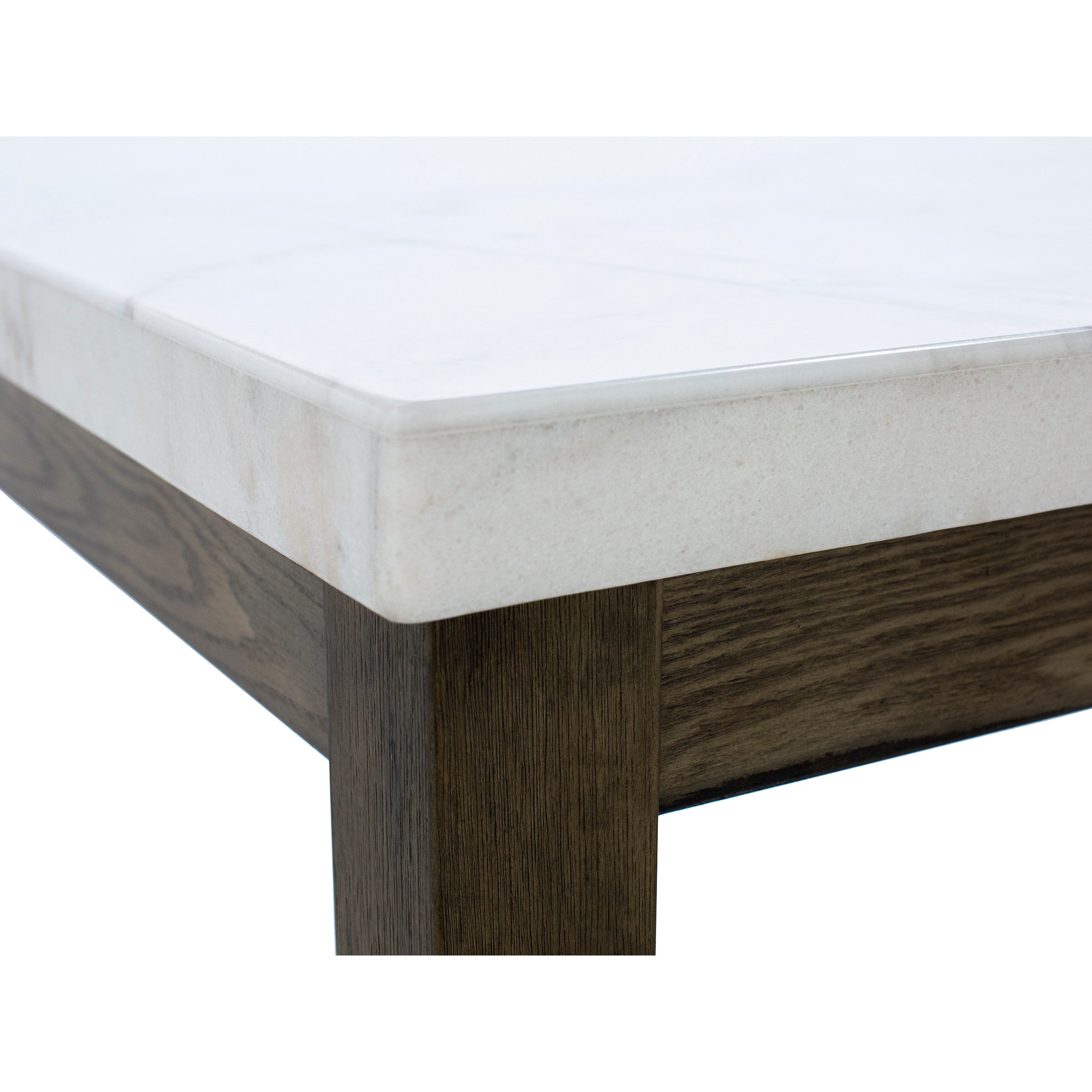 Close-up of a table corner with a white marble top and dark wood legs.