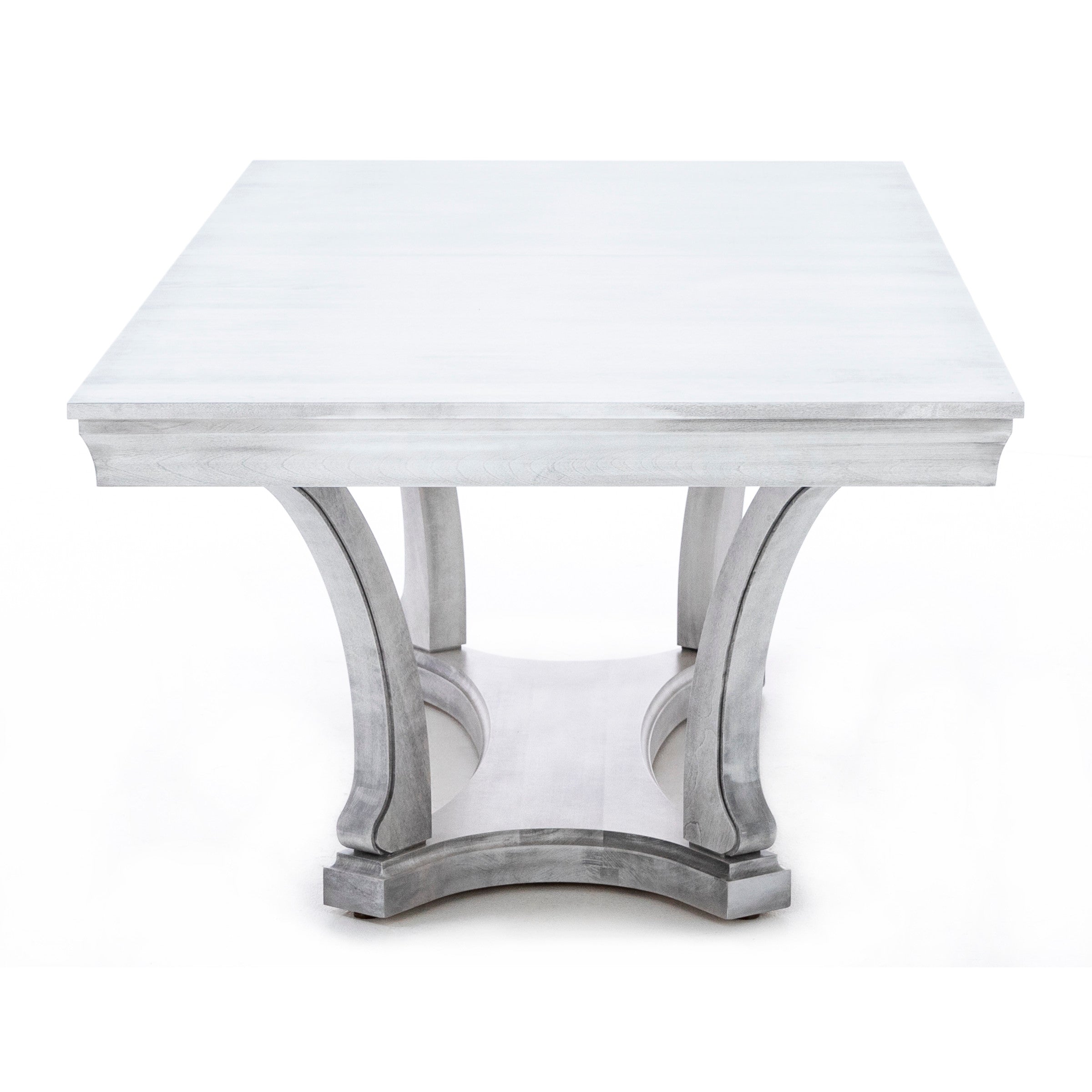 Square dining table with curved legs and a light gray wood finish