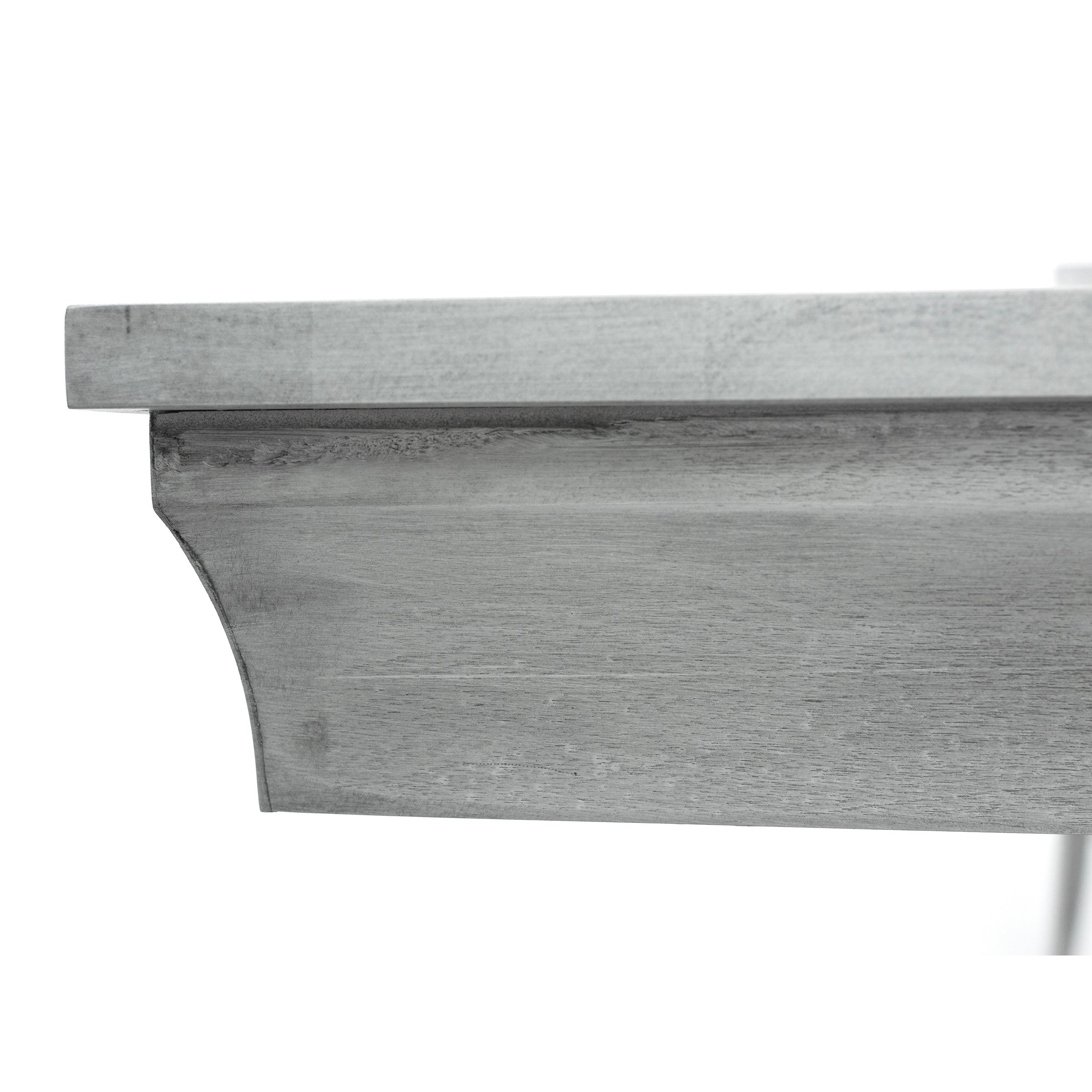 Close-up of gray wood molding with a decorative edge.