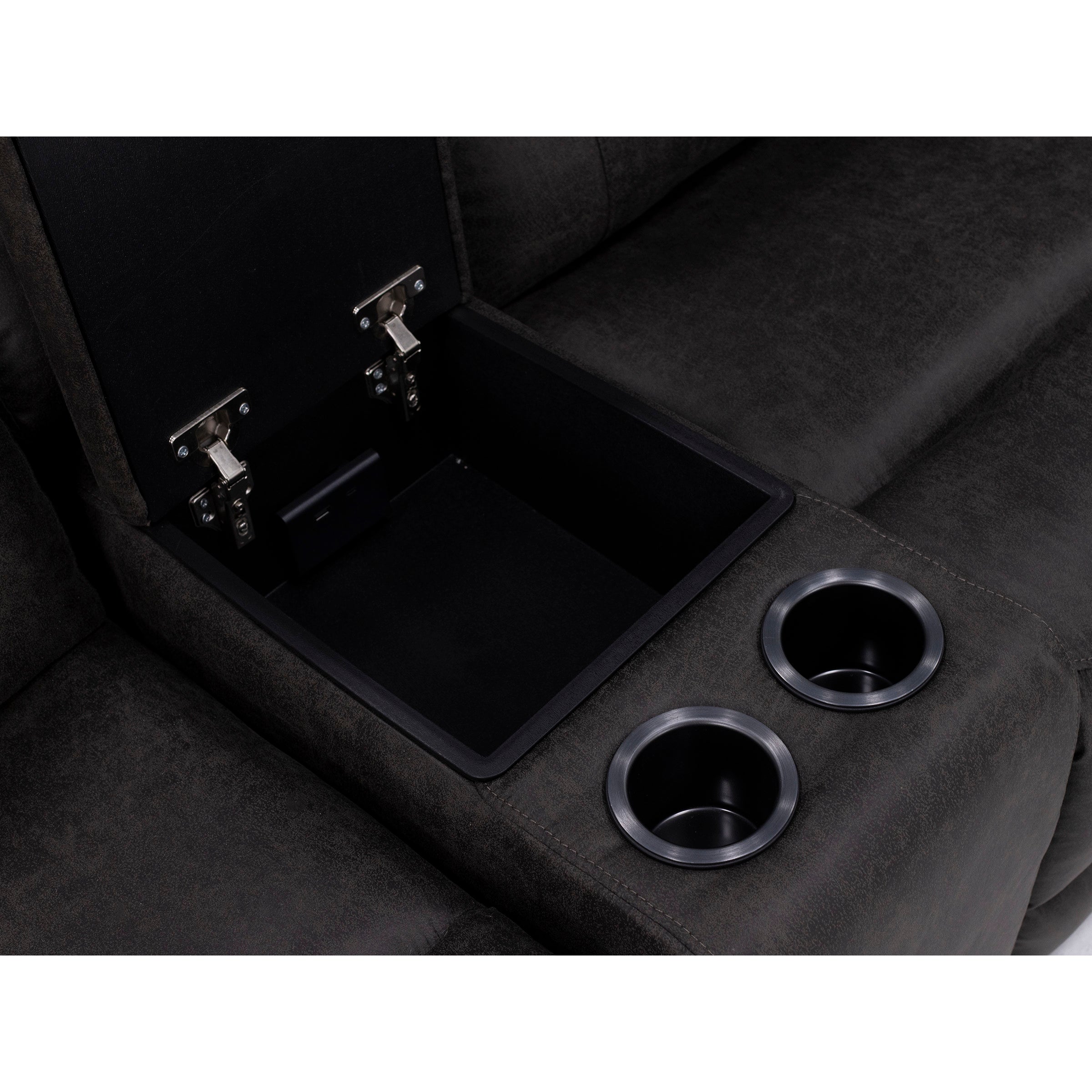 Close-up of a sofa's center console with open storage compartment and two cup holders.