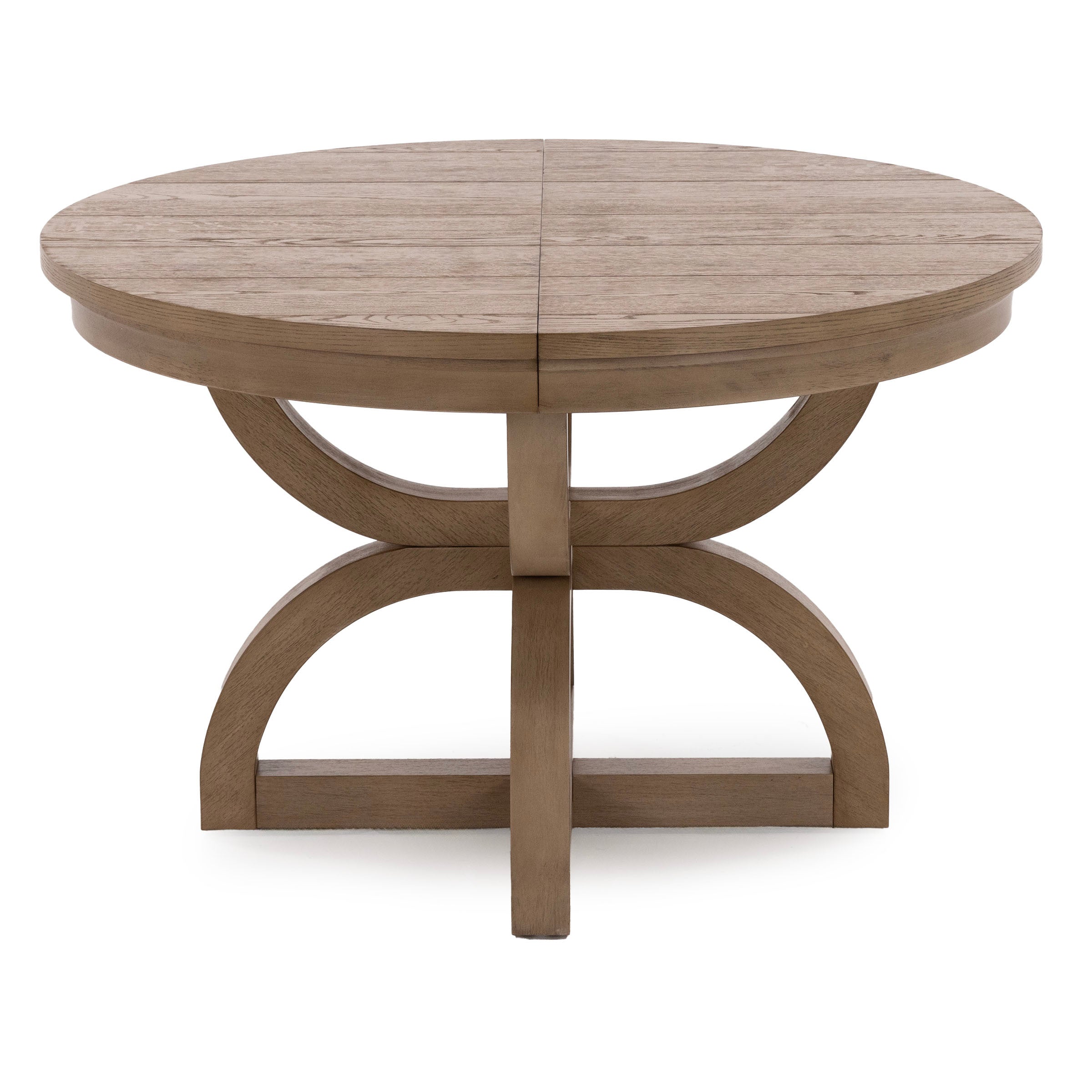 Round wooden dining table with a light brown finish and curved base.