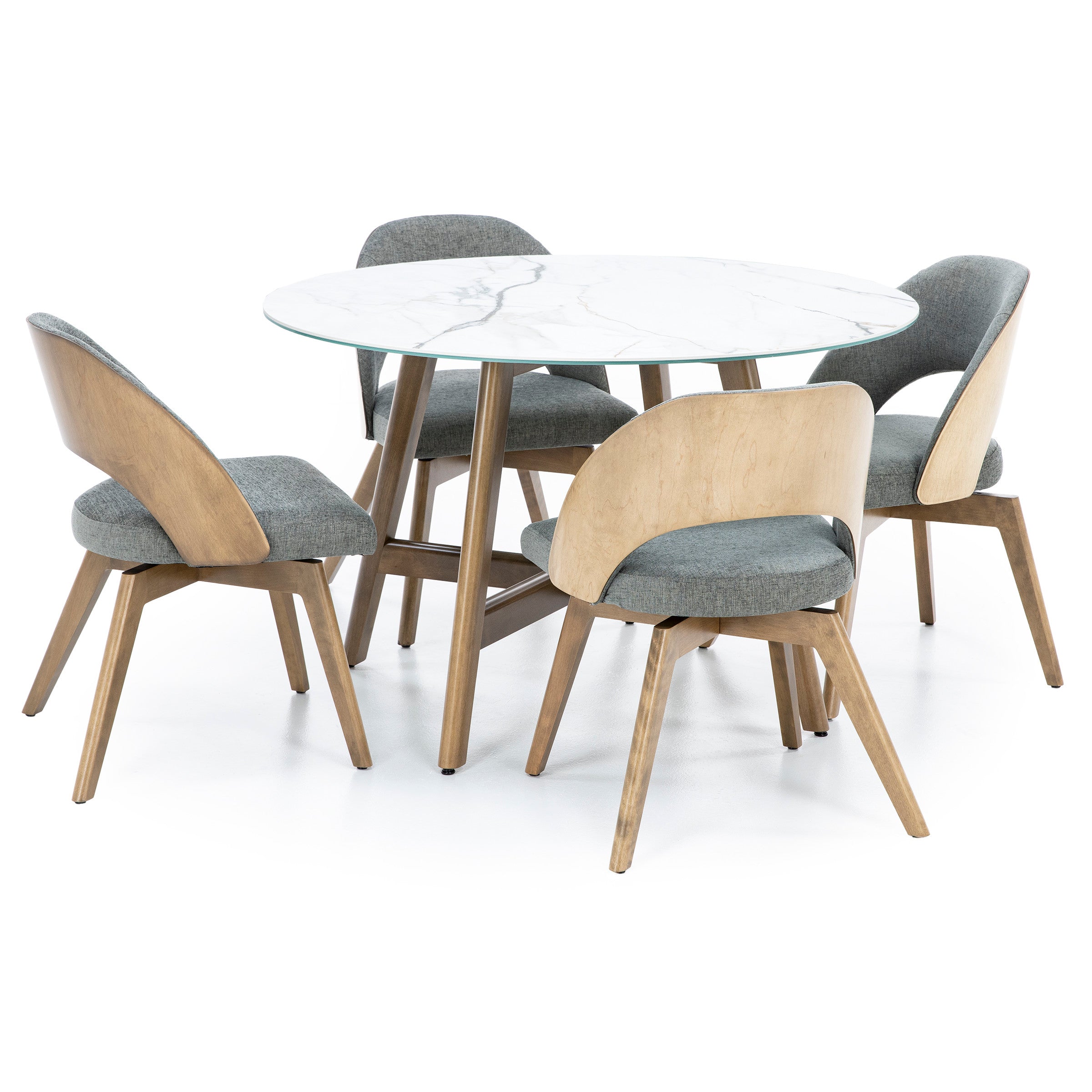 Round dining table with four wood chairs upholstered in gray fabric.