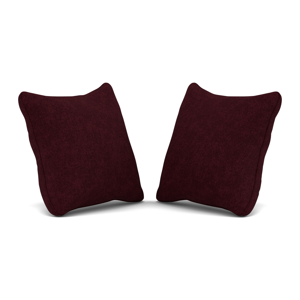 Two dark red throw pillows set against a white background.