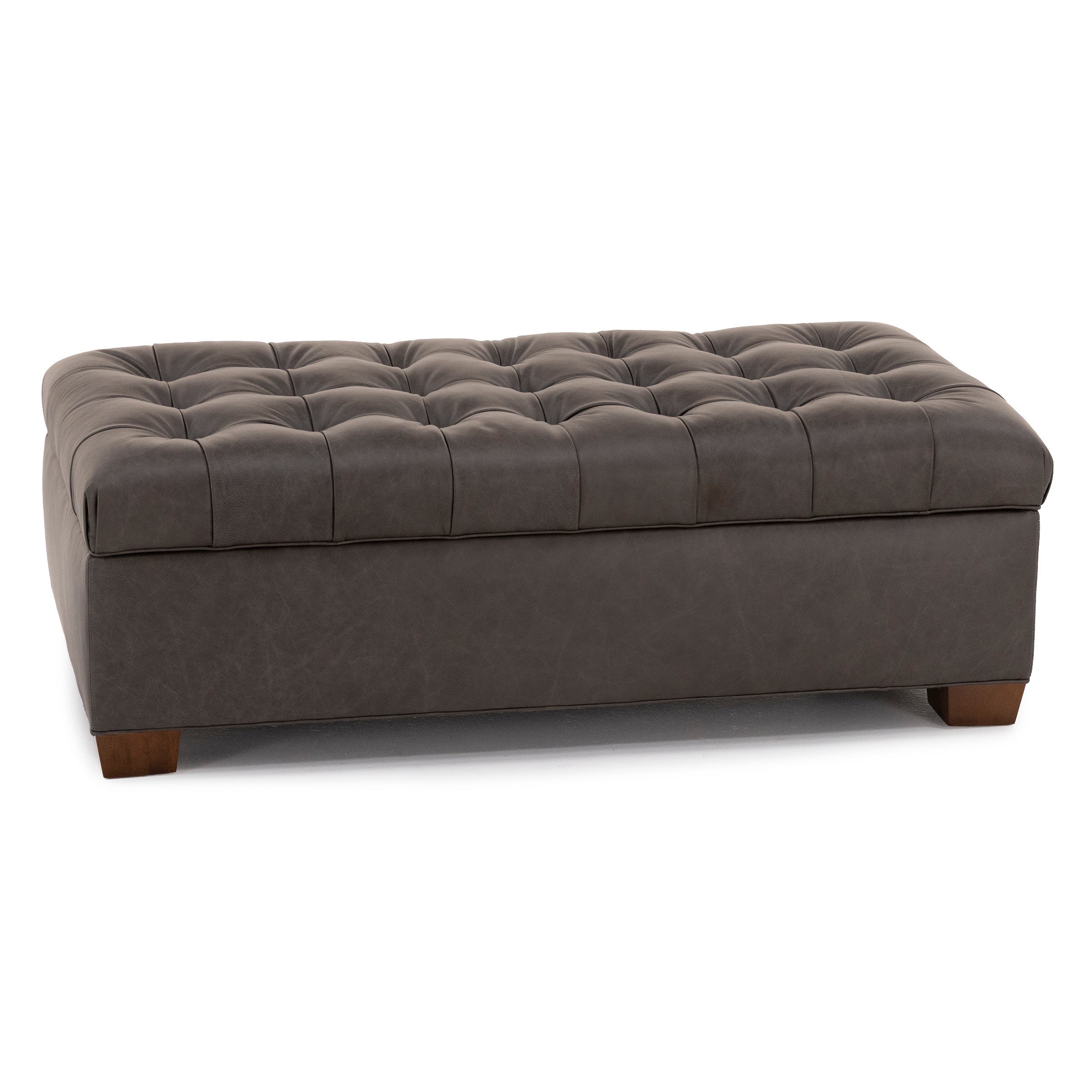 Dark gray tufted rectangular ottoman with wooden feet.