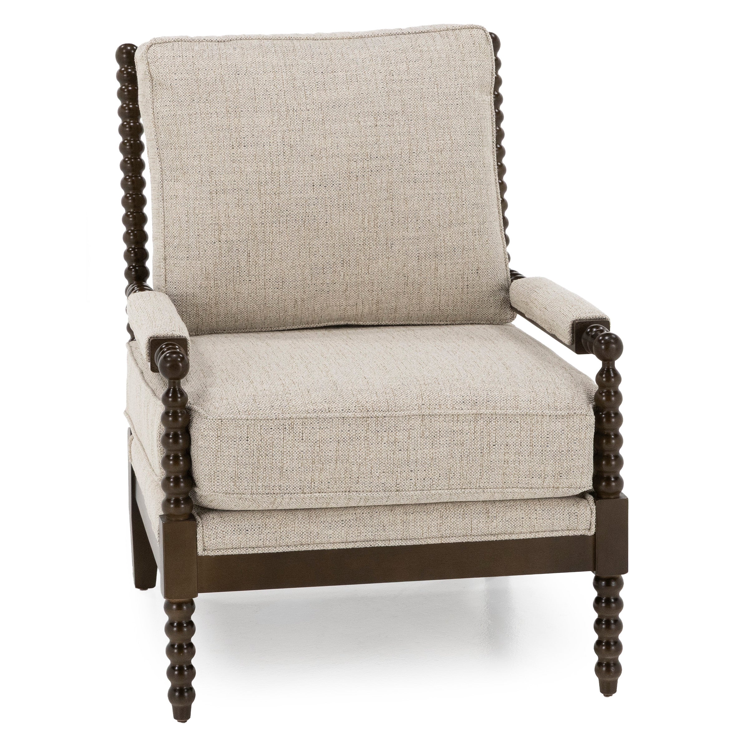 Beige upholstered armchair with dark wooden frame and spindle legs.