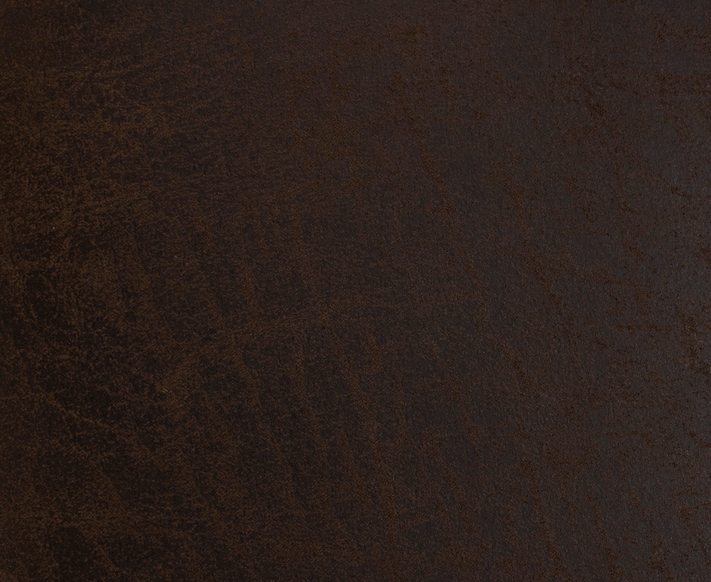 Dark brown textured surface, possibly leather or faux leather material.