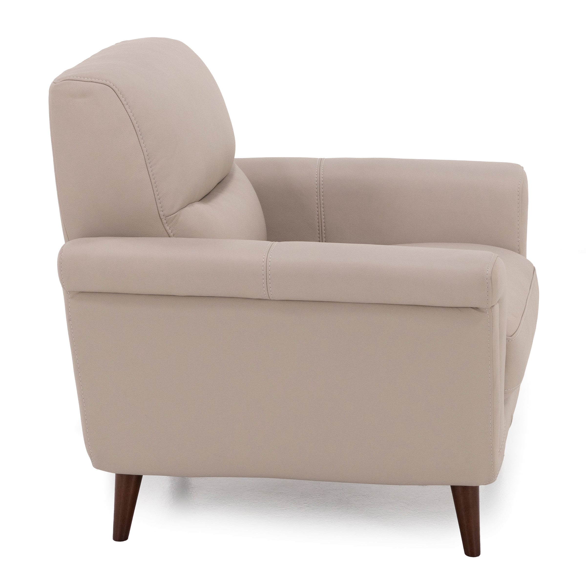 Side view of a beige upholstered armchair with wooden legs.
