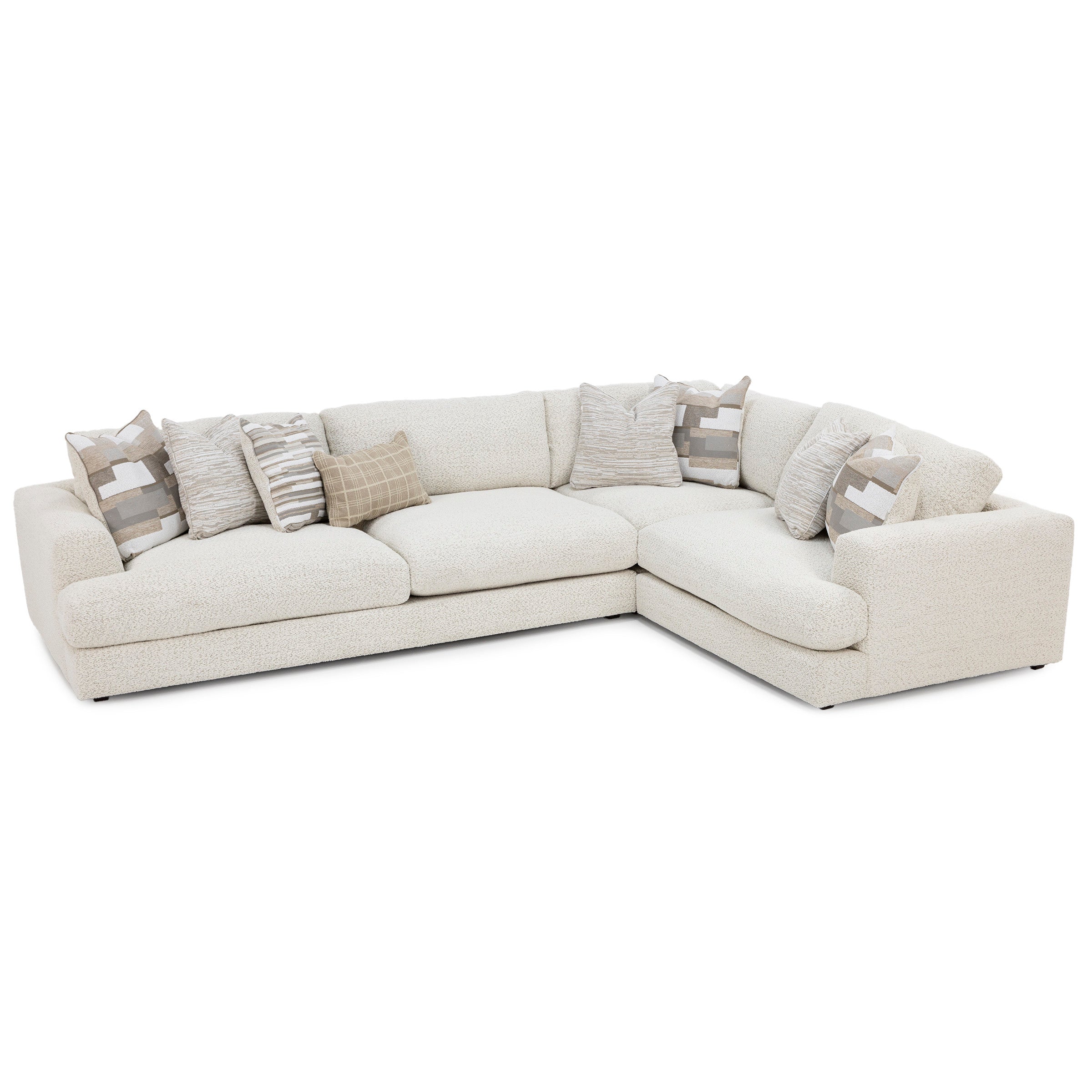 L-shaped cream sectional sofa with textured fabric and assorted neutral throw pillows.