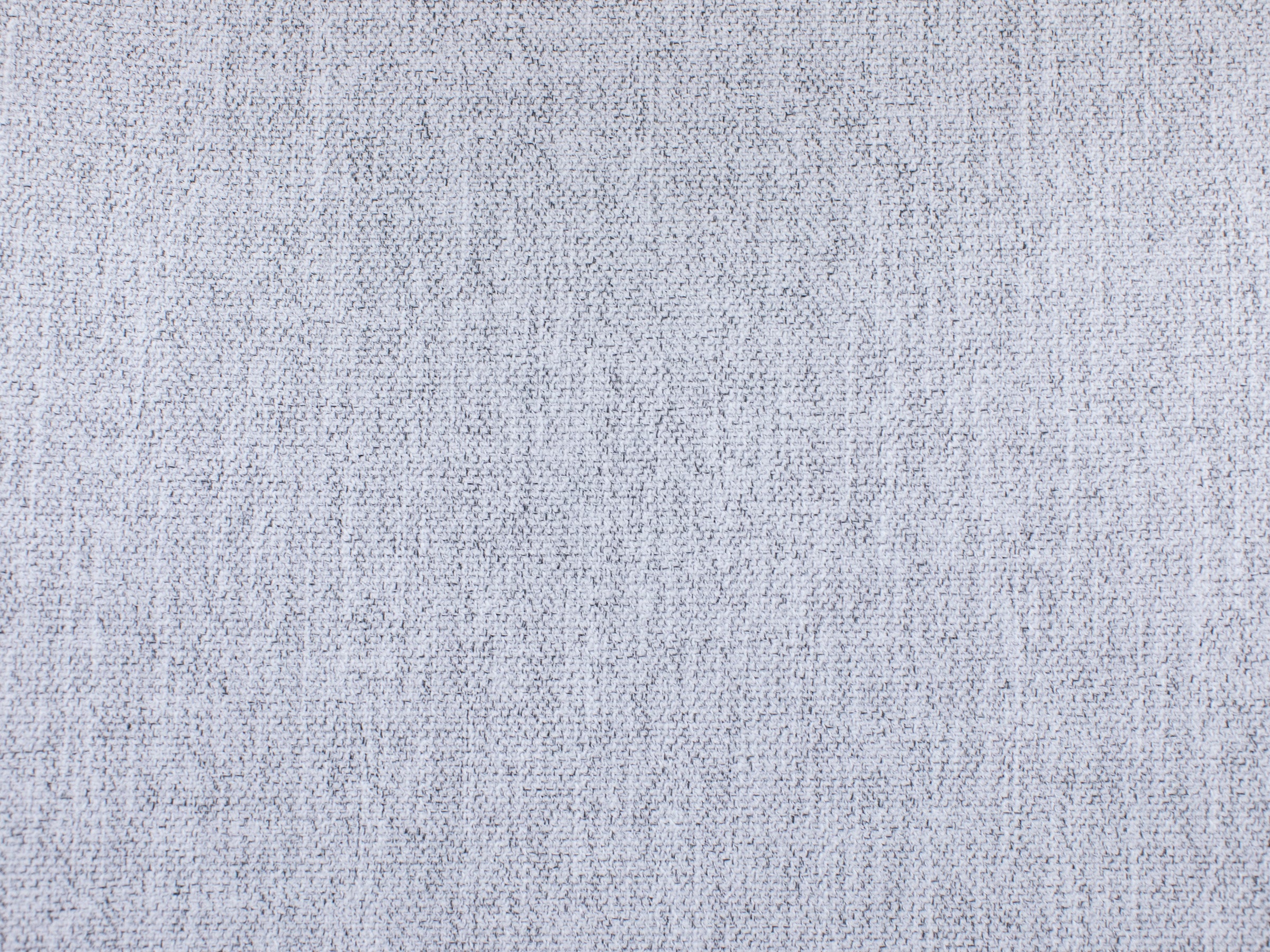 Light gray woven fabric texture, shown in close-up.