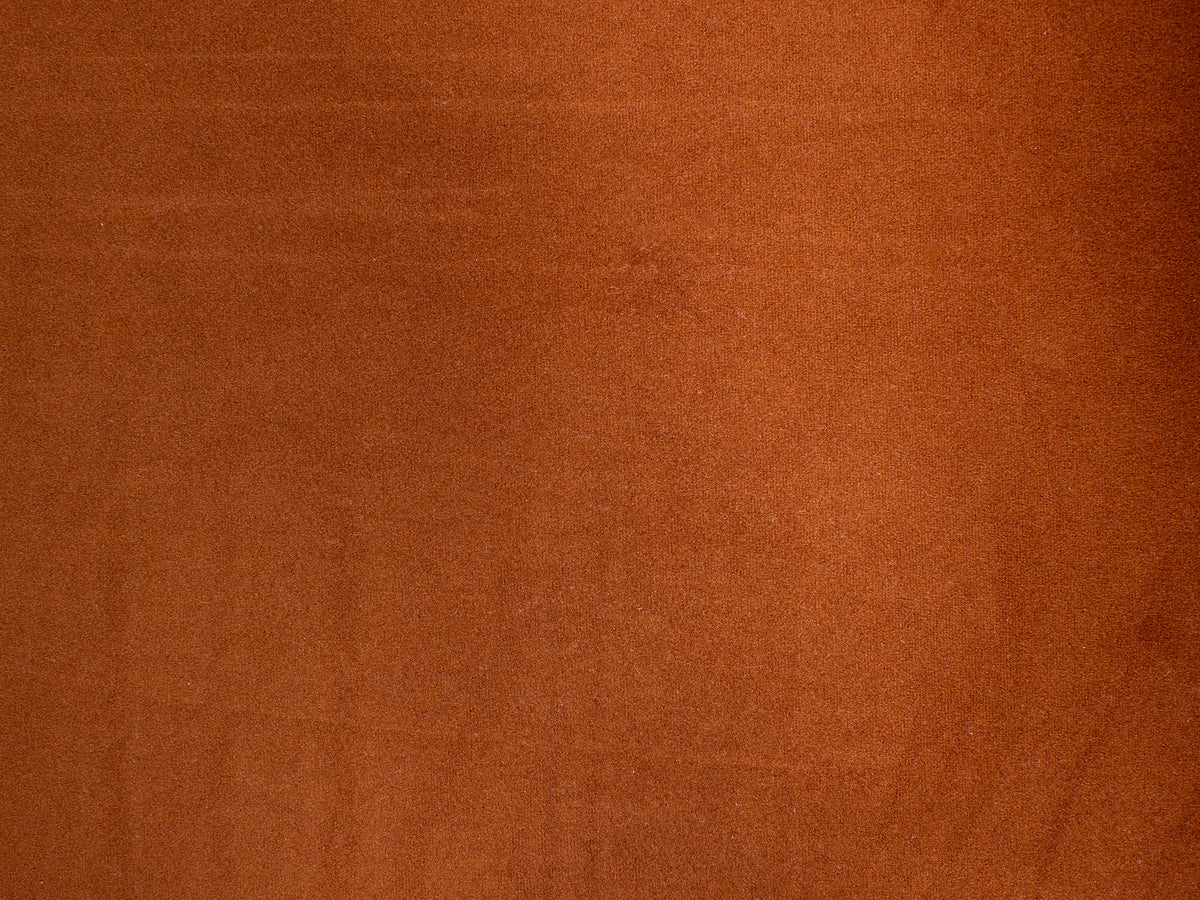 Solid rust brown suede texture background.