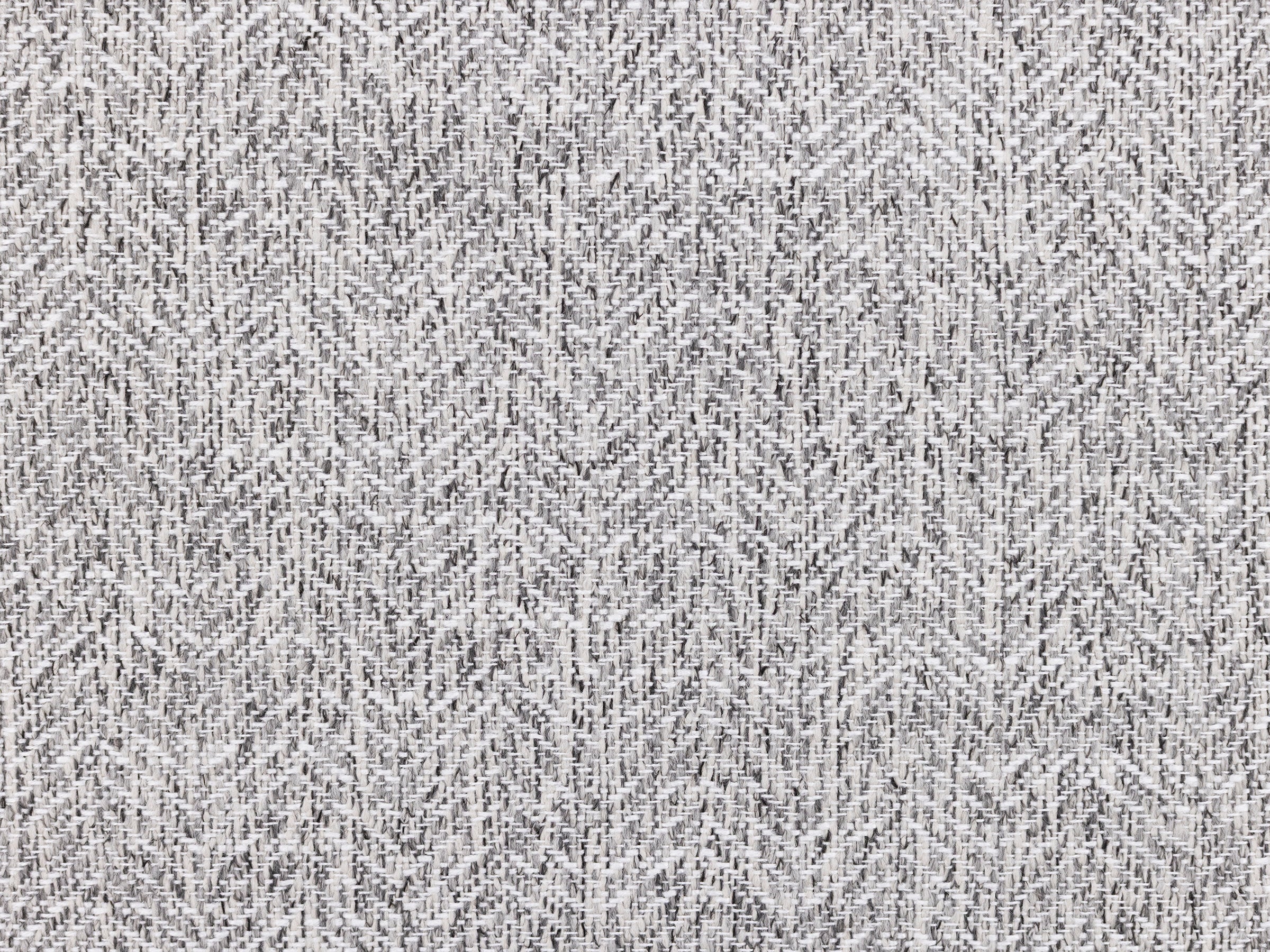 Close-up of grey woven fabric with subtle herringbone pattern.