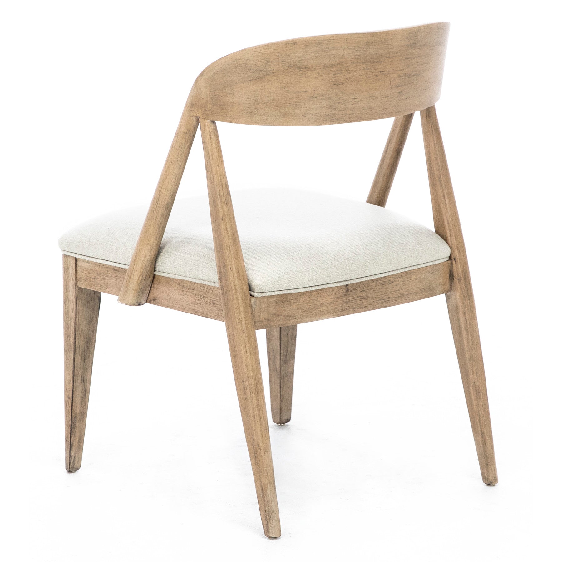 Back view of a wooden dining chair with light fabric seat and angled legs.