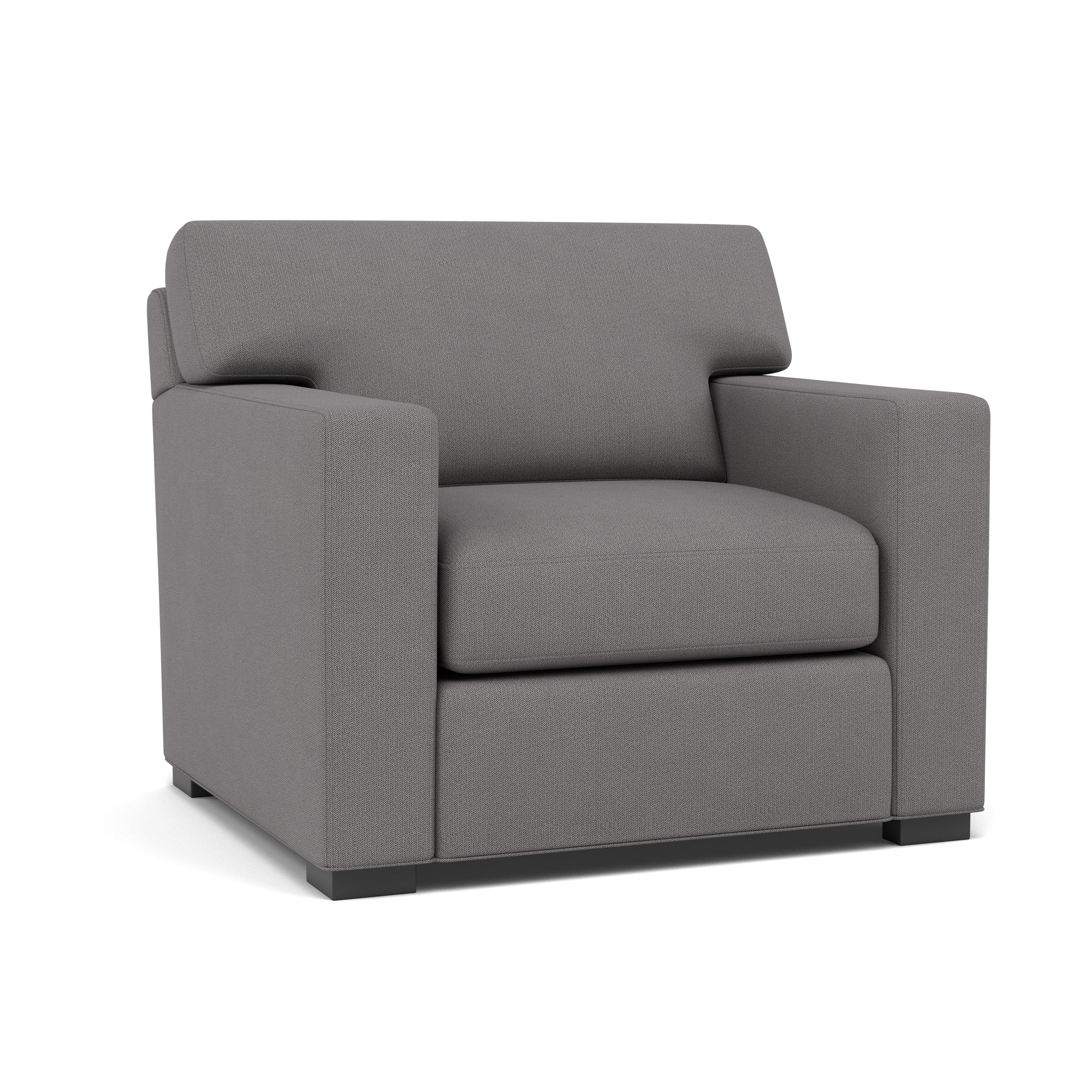 Modern gray armchair with boxy design and low legs, shown against white background.