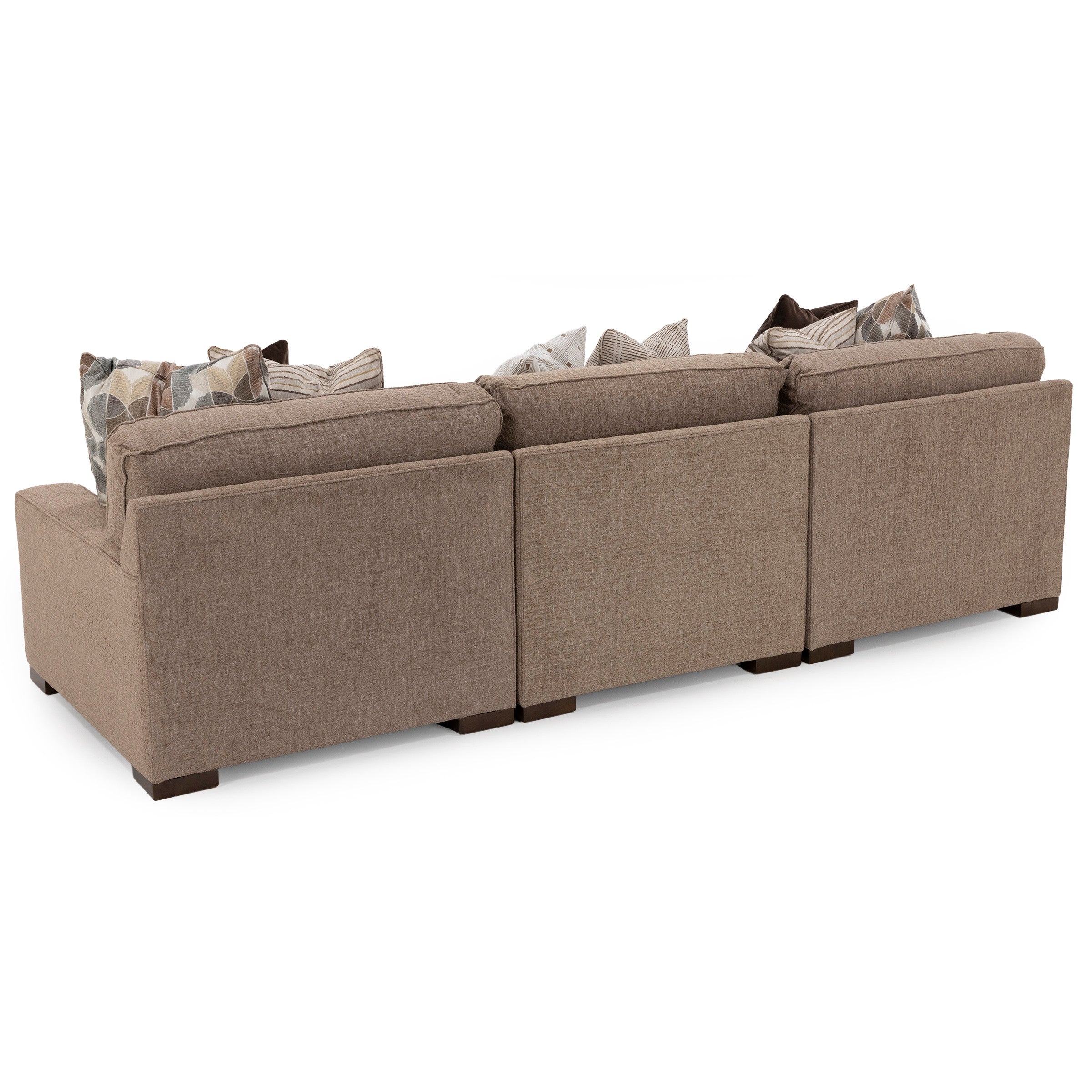 Back view of tan three-seat sofa with patterned accent pillows.