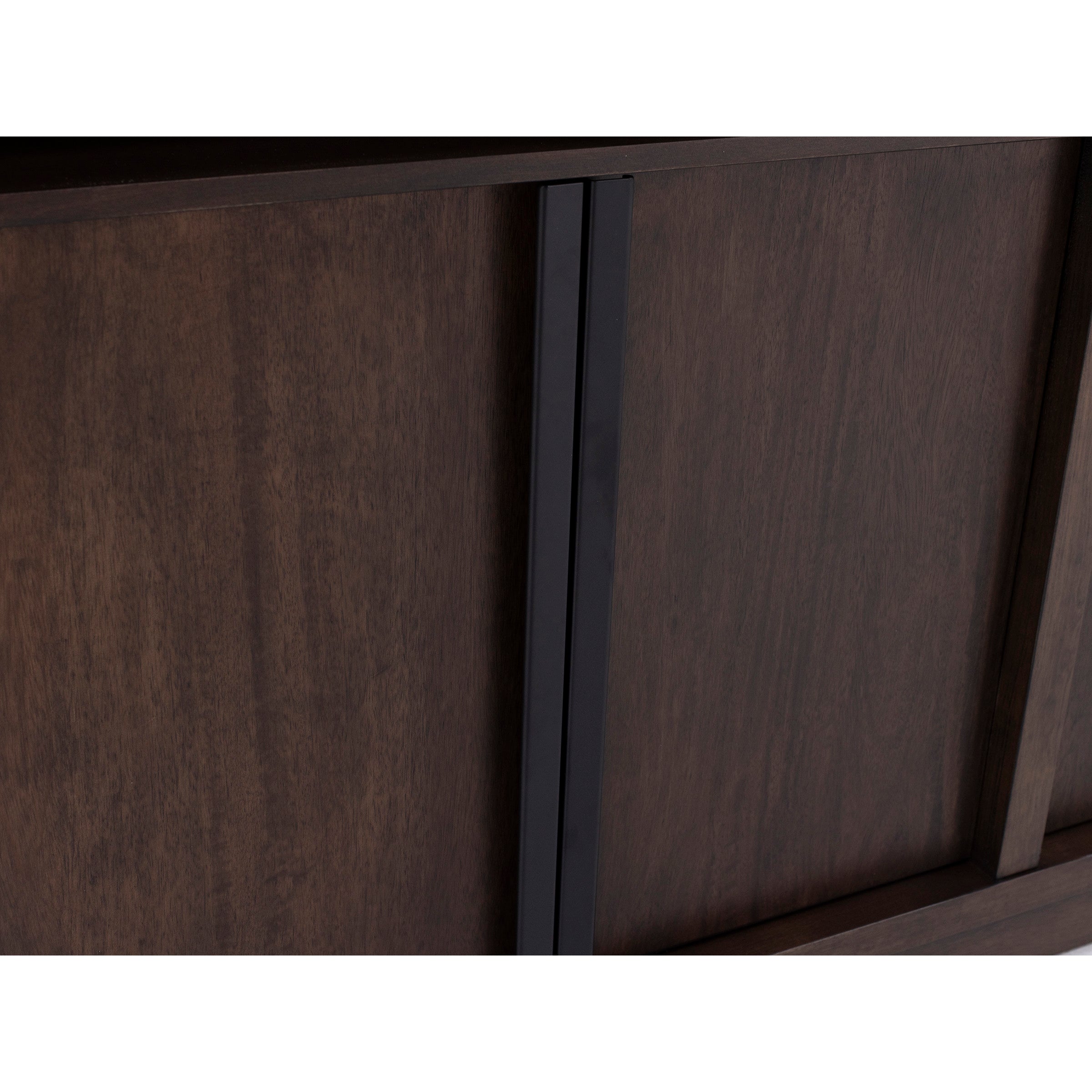 Close-up of dark brown wooden cabinet with vertical black handle.