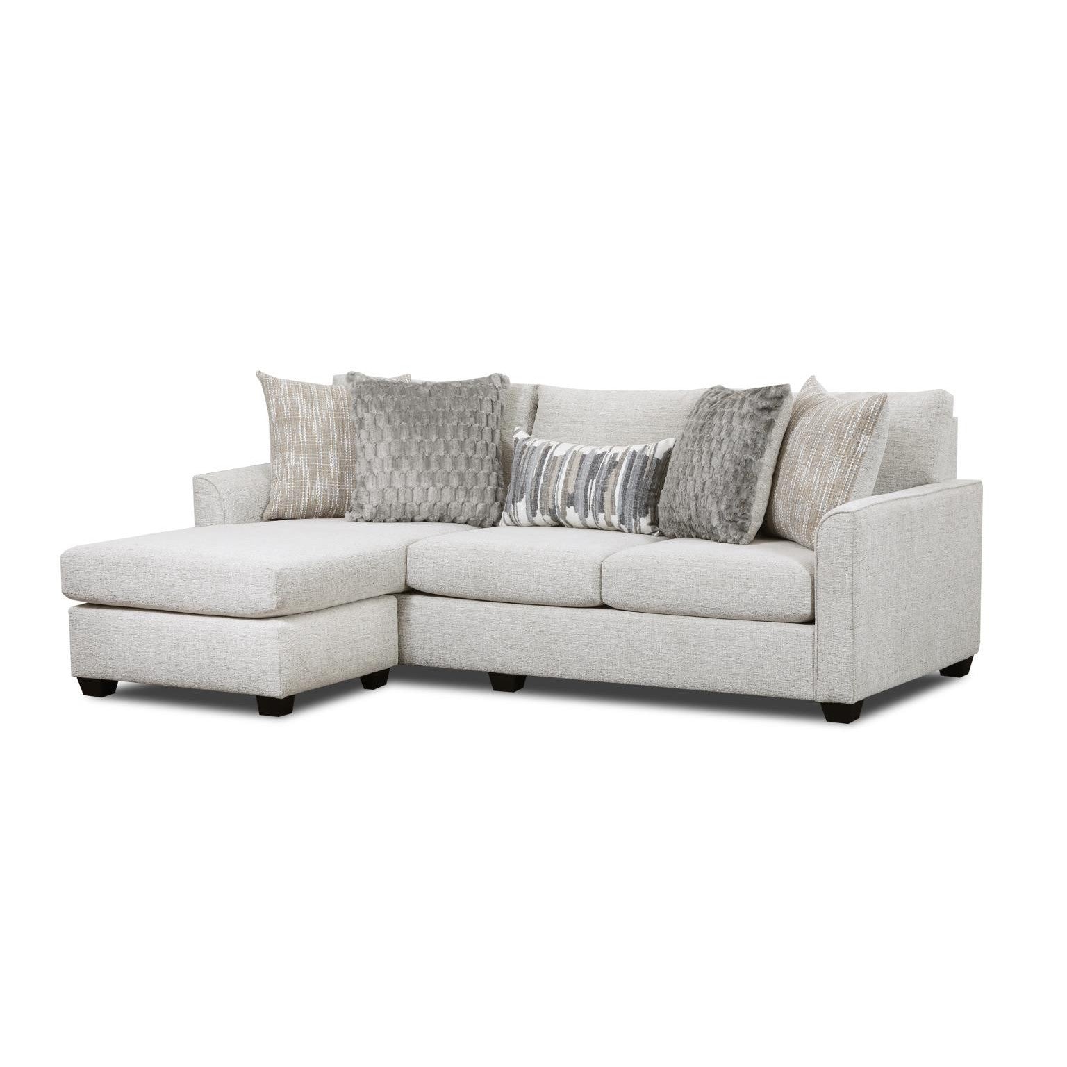 Light gray sectional sofa with assorted accent pillows.