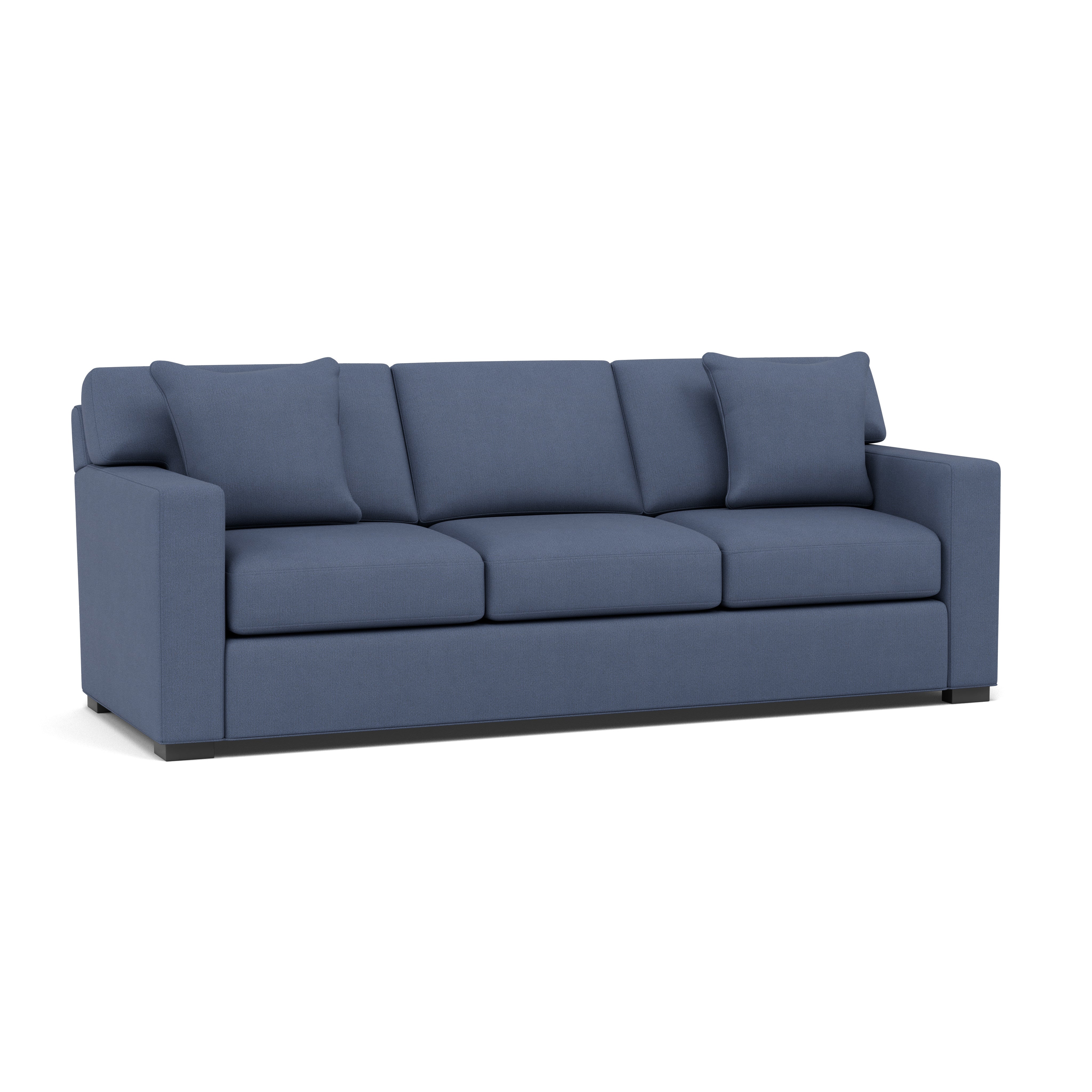 Blue three-seat sofa with square arms and two matching pillows.