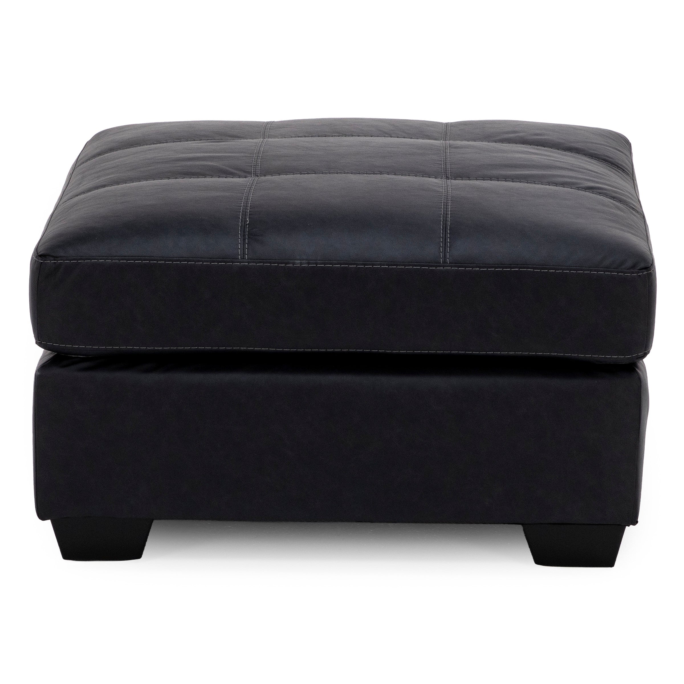 Square black leather ottoman with tufted top and short block legs.