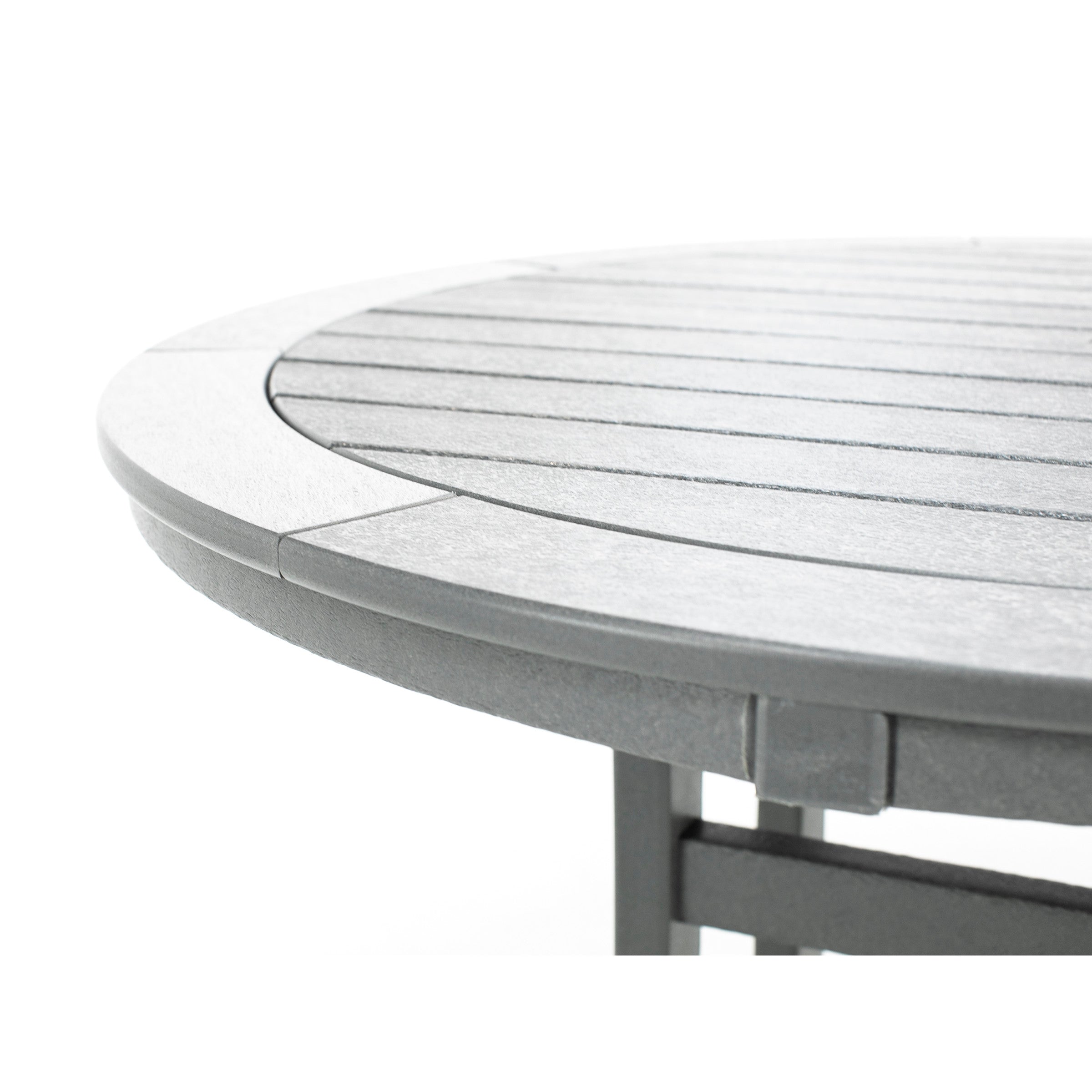 Close-up of a round, gray outdoor table with slatted top.