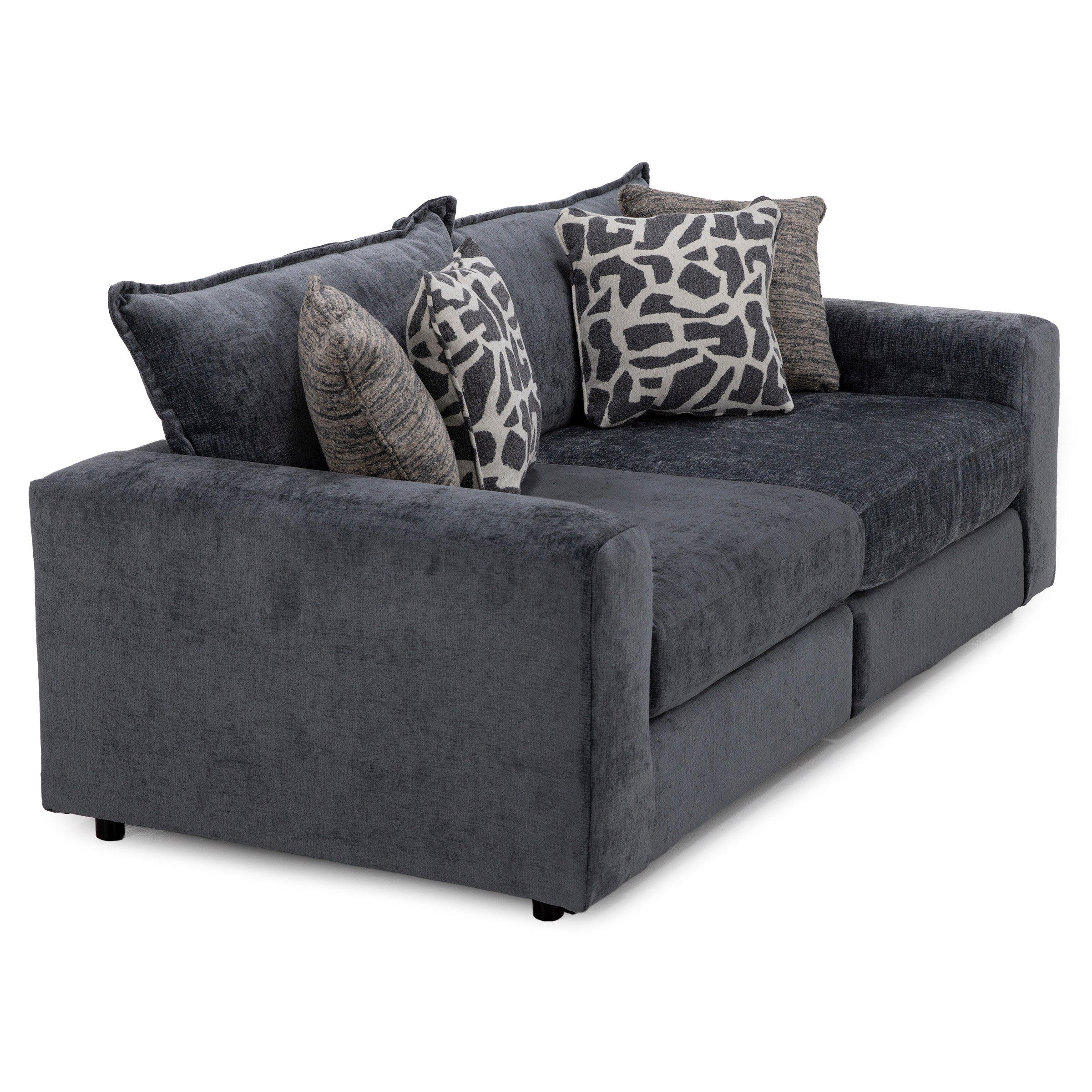 Dark gray upholstered sofa with patterned and textured accent pillows.