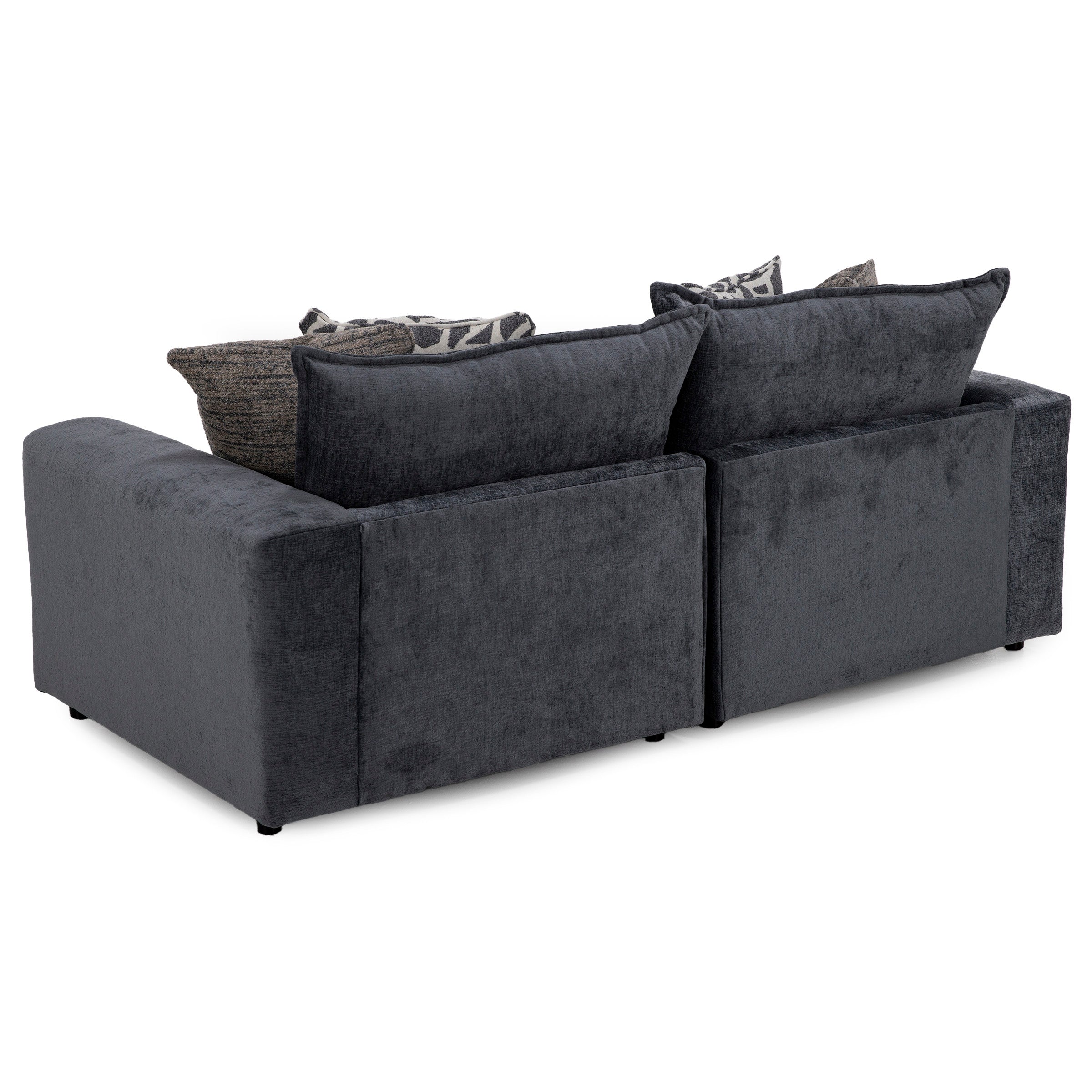 Dark gray sectional sofa viewed from the back, with patterned throw pillows.